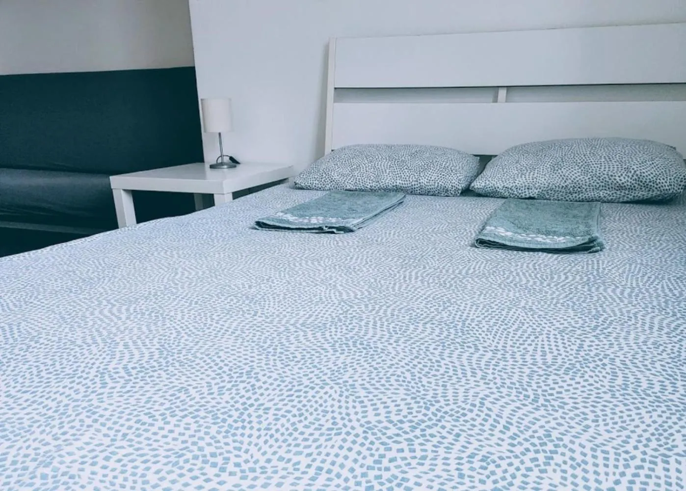 Bed in Sleepover City Center GuestRooms