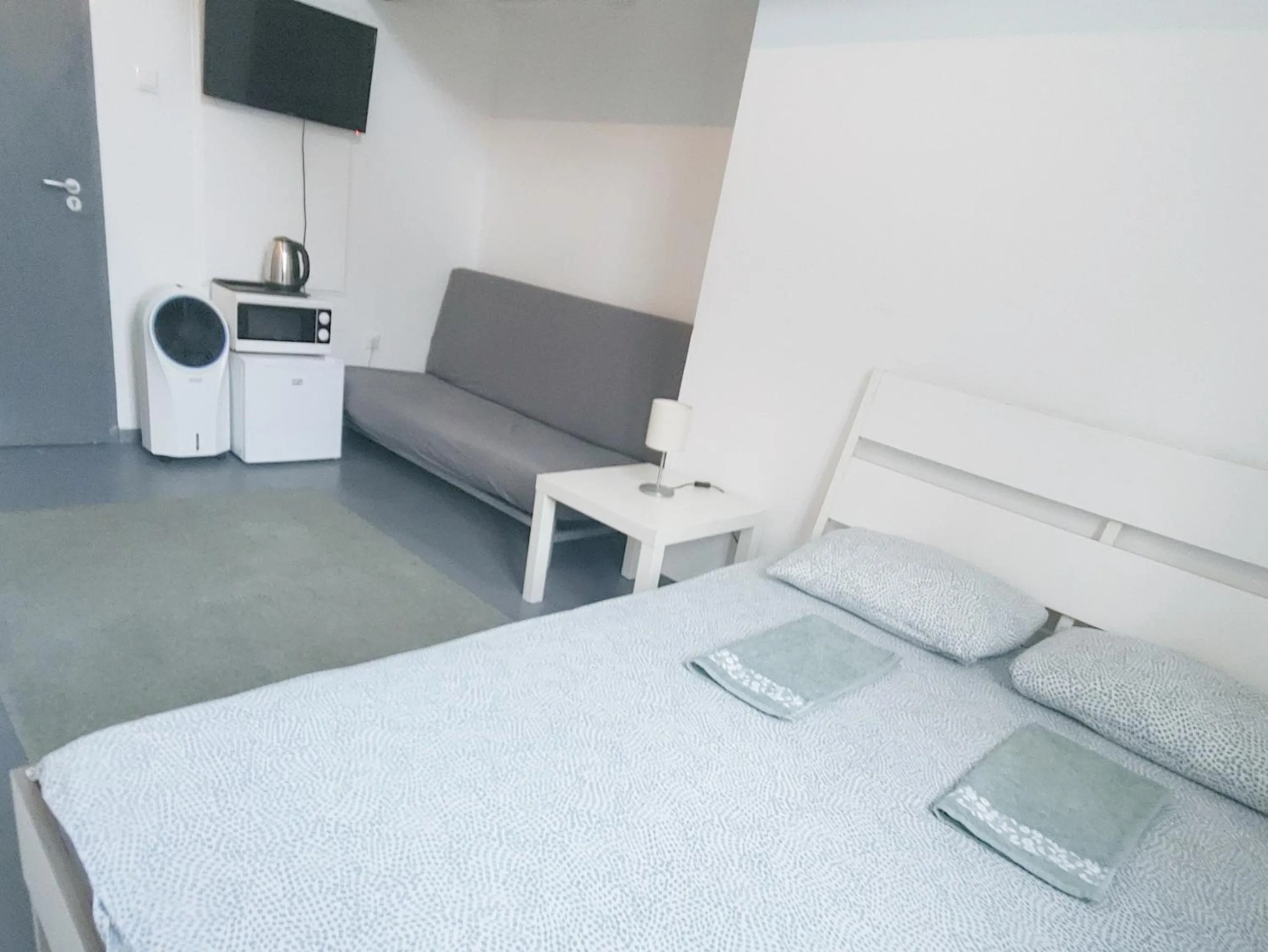 Bed in Sleepover City Center GuestRooms