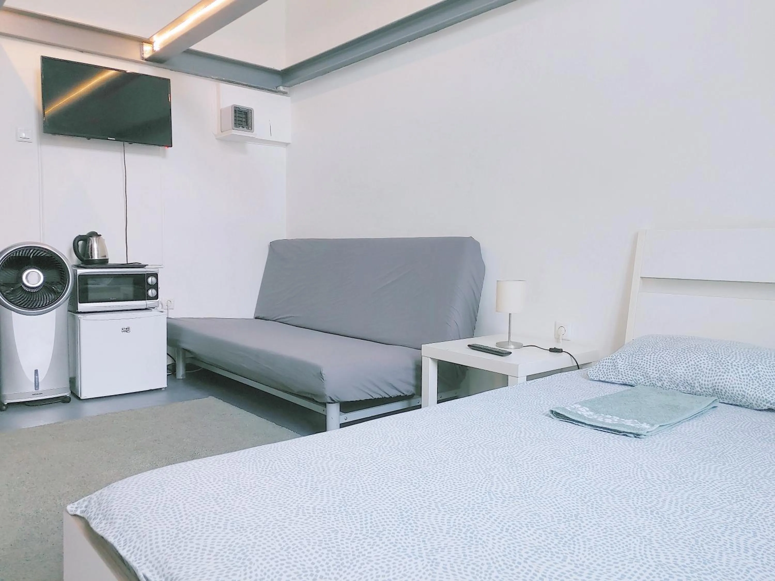 Bed in Sleepover City Center GuestRooms
