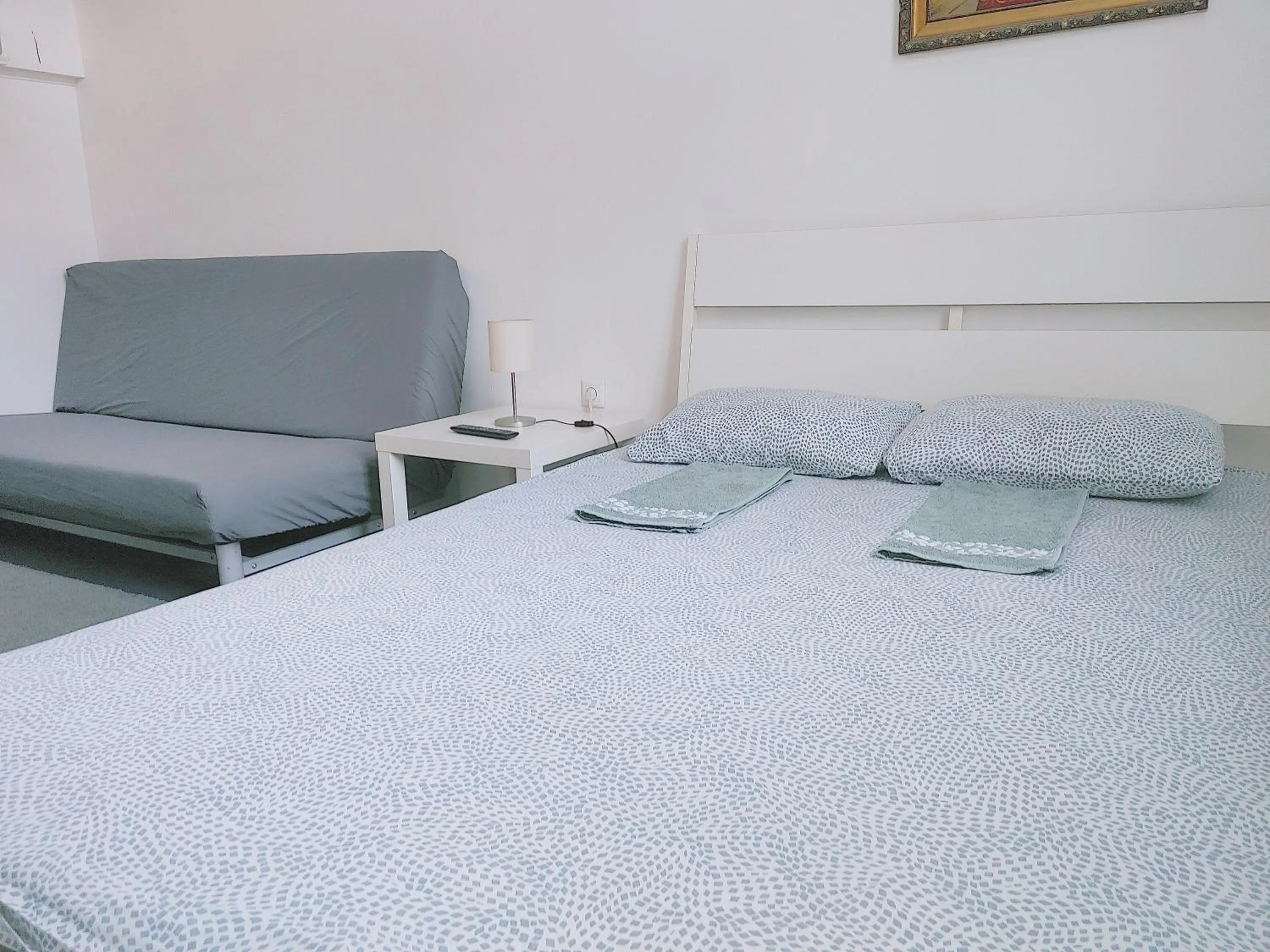 Bed in Sleepover City Center GuestRooms