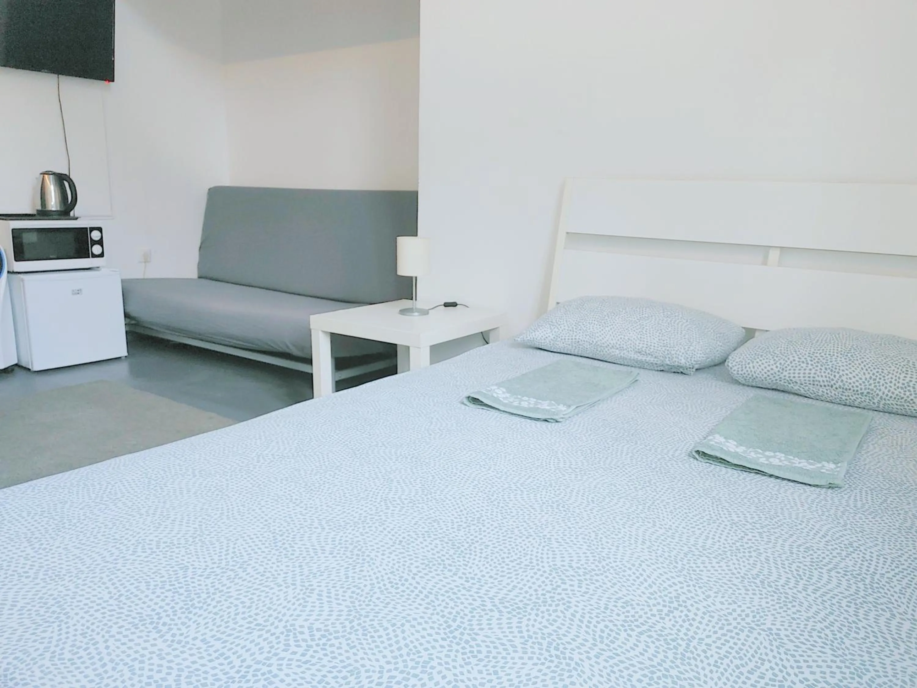 Bed in Sleepover City Center GuestRooms