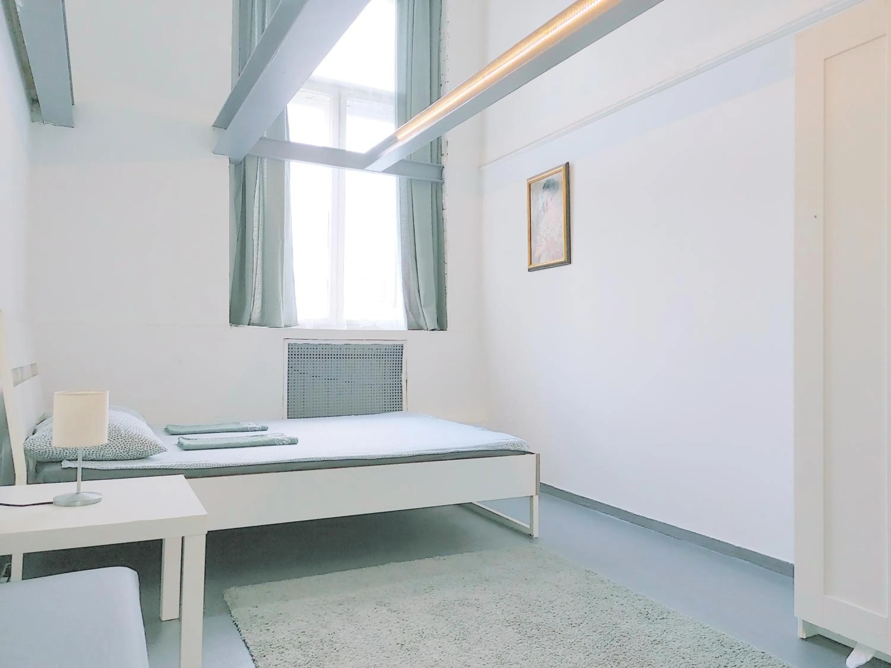 Bed in Sleepover City Center GuestRooms