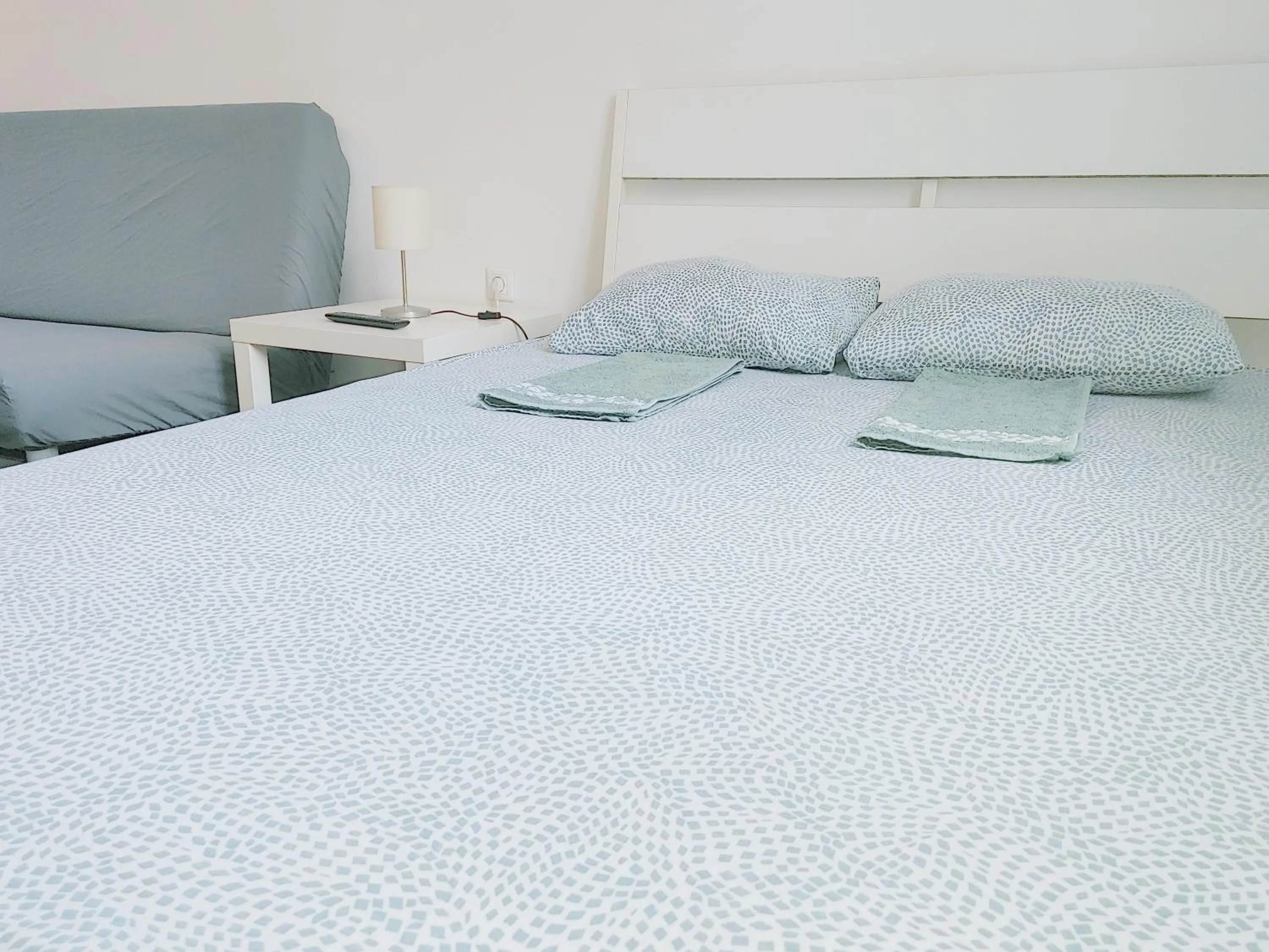Bed in Sleepover City Center GuestRooms