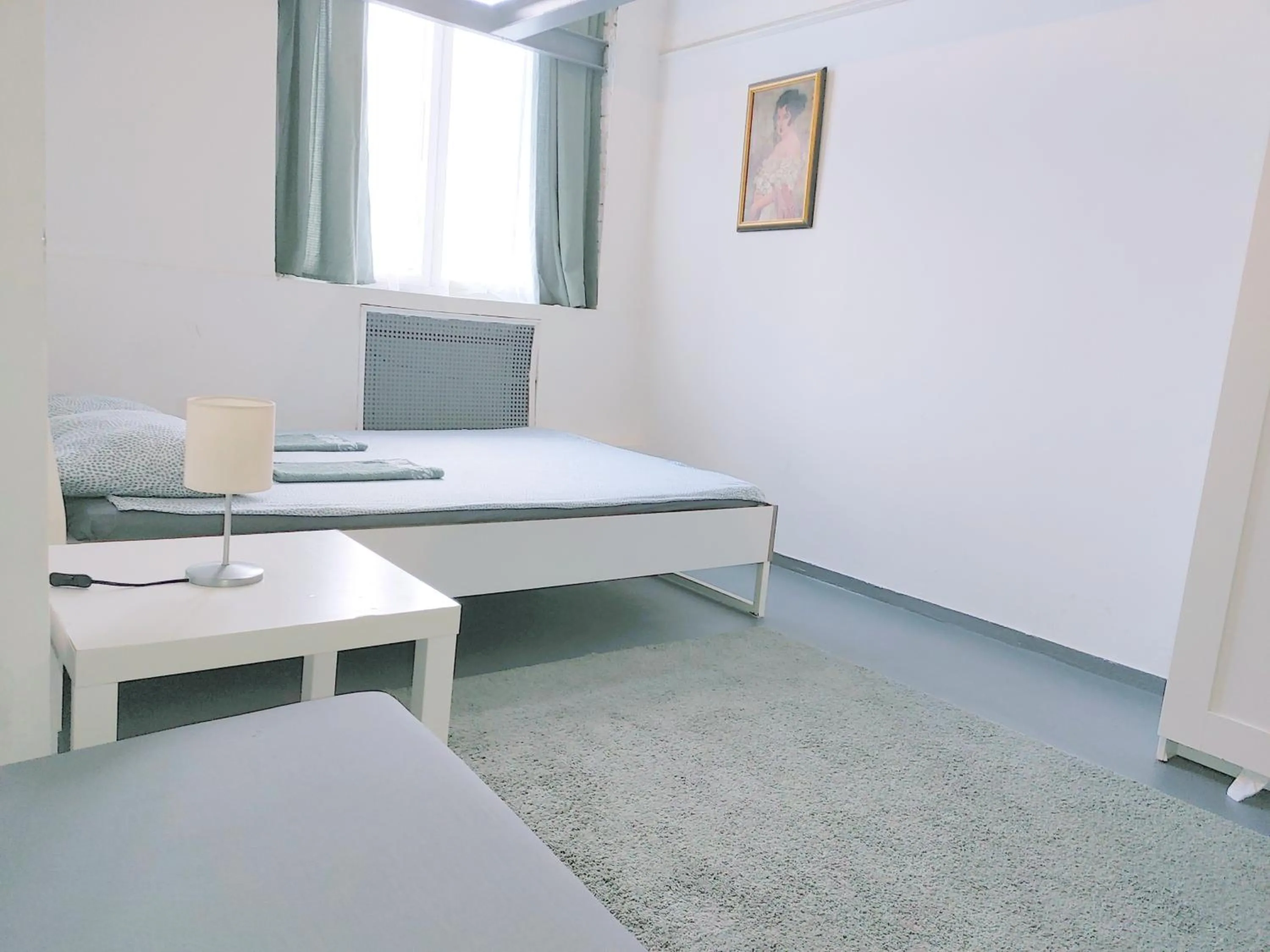 Bed in Sleepover City Center GuestRooms