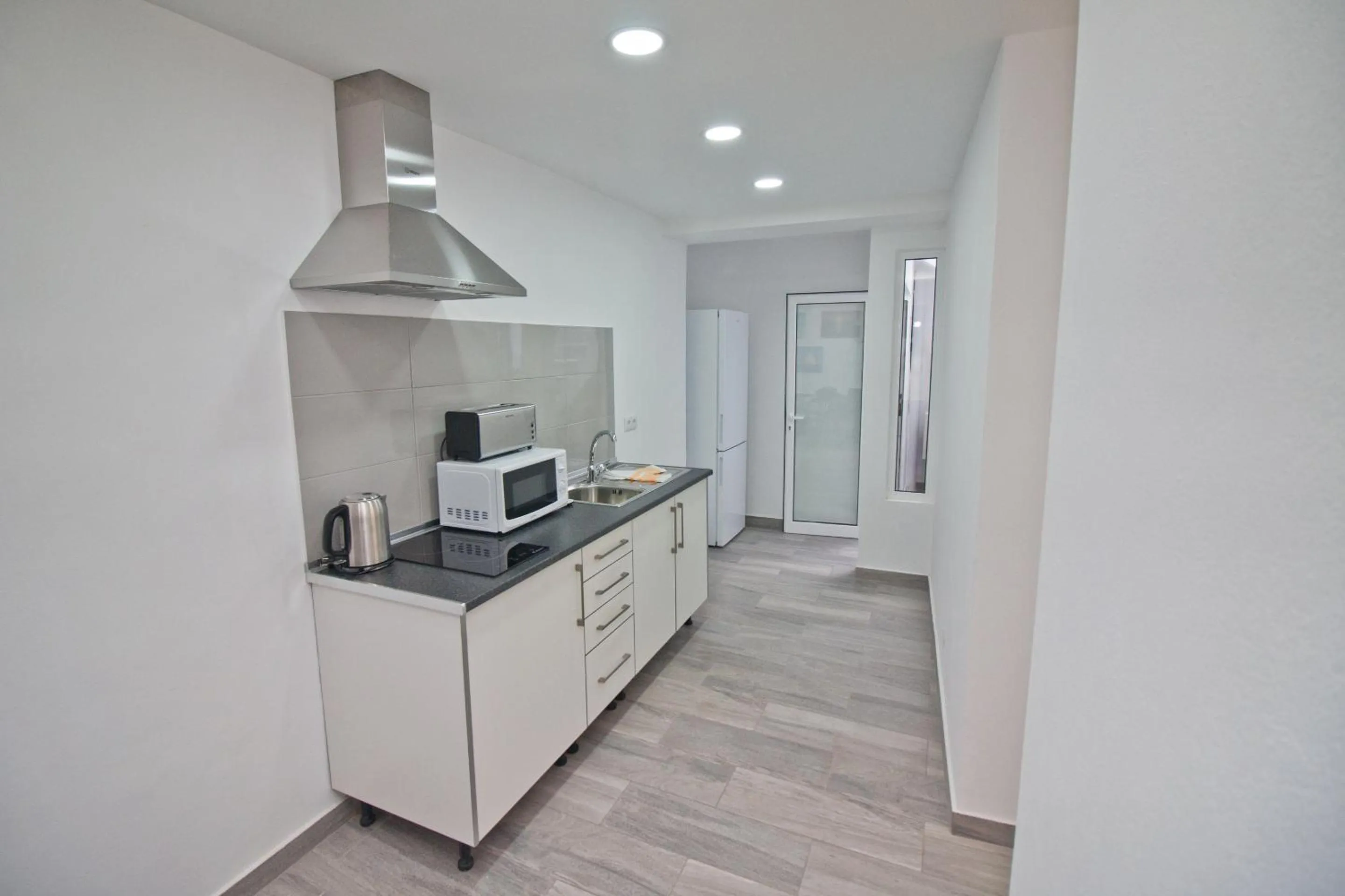 Kitchen or kitchenette in New Village Guest House