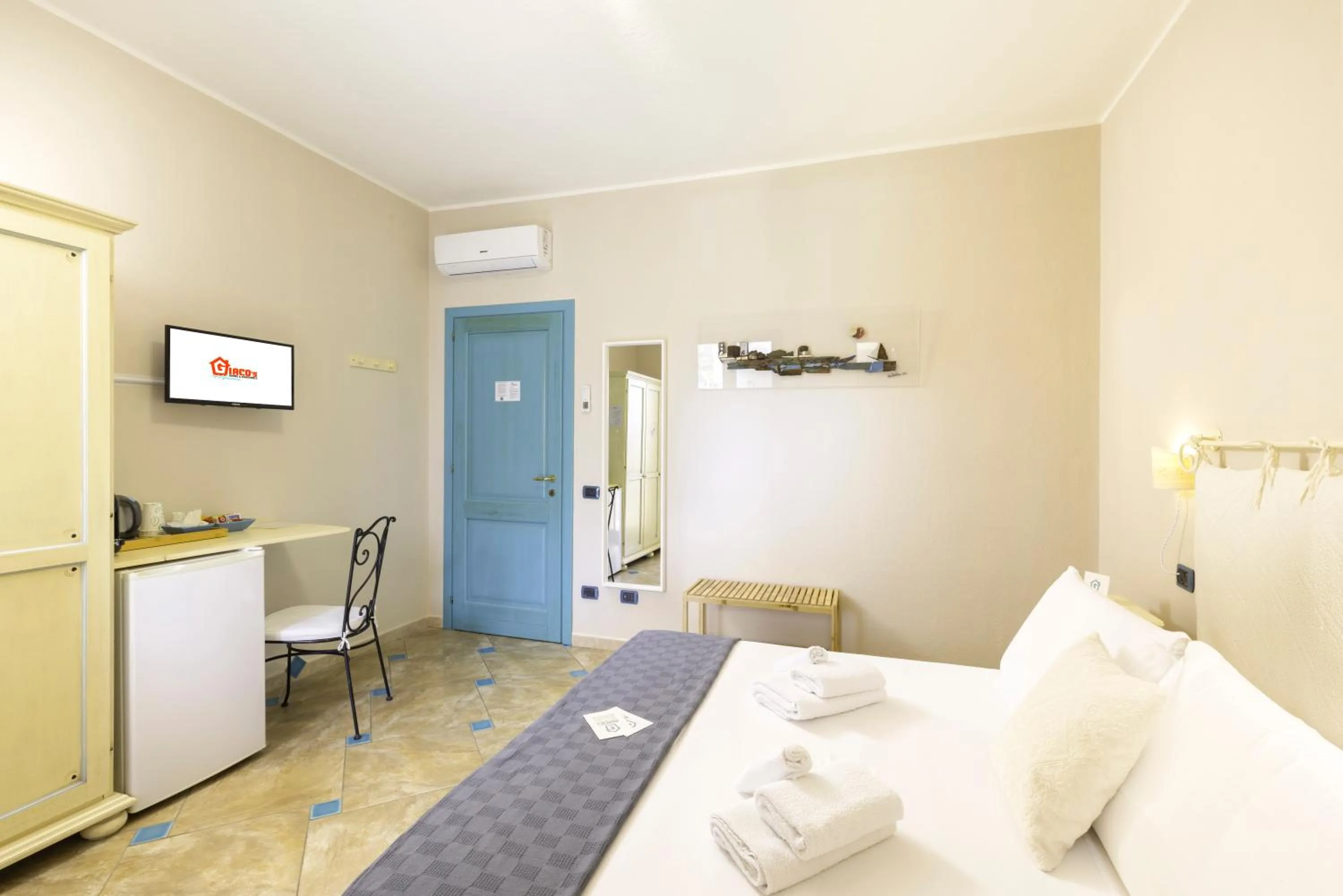 Bed in Giaco's Rooms