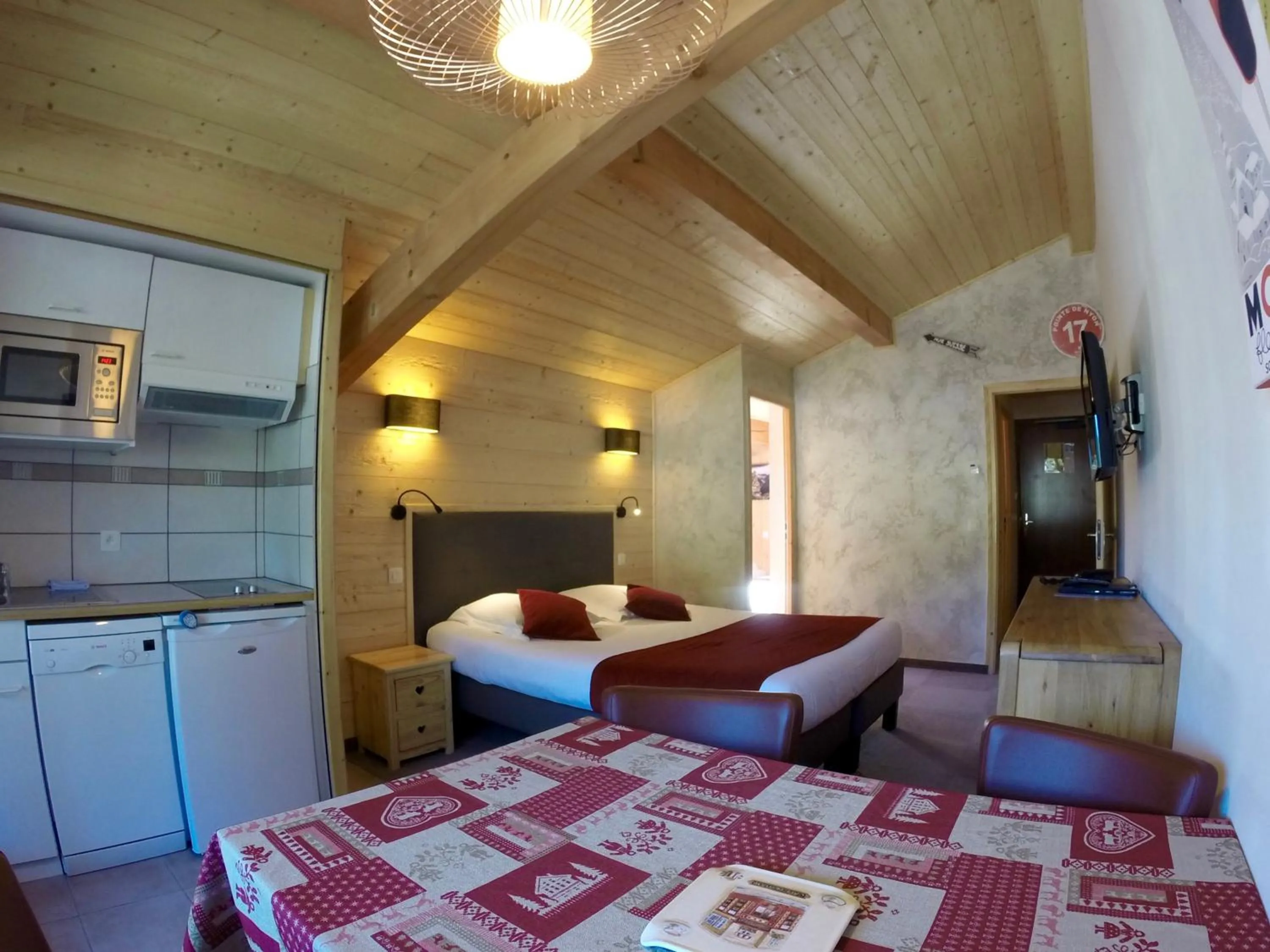 Kitchen or kitchenette, Bed in Hôtel Les Côtes, Résidence Loisirs et Chalets