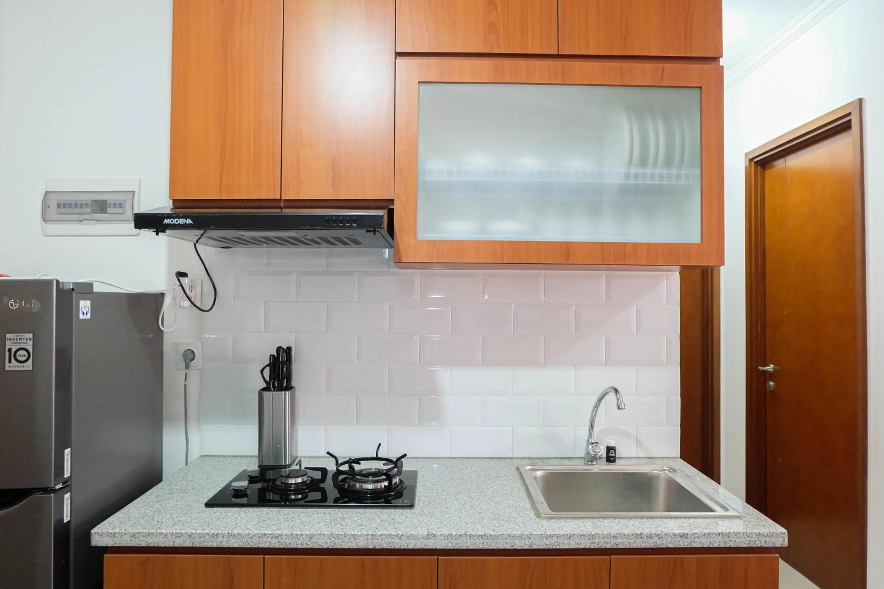 Kitchen or kitchenette in Fabulous 2BR Signature Park Grande Apartment By Travelio
