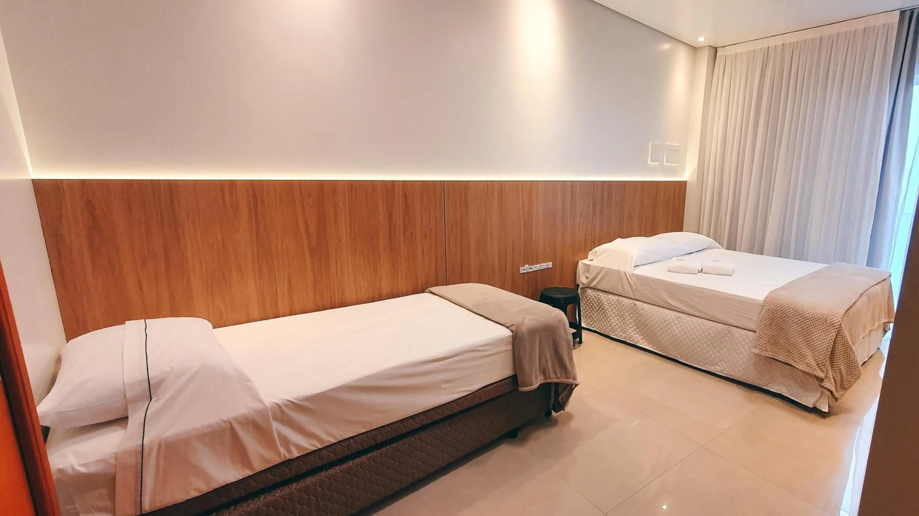 Bed in Hotel Brasil