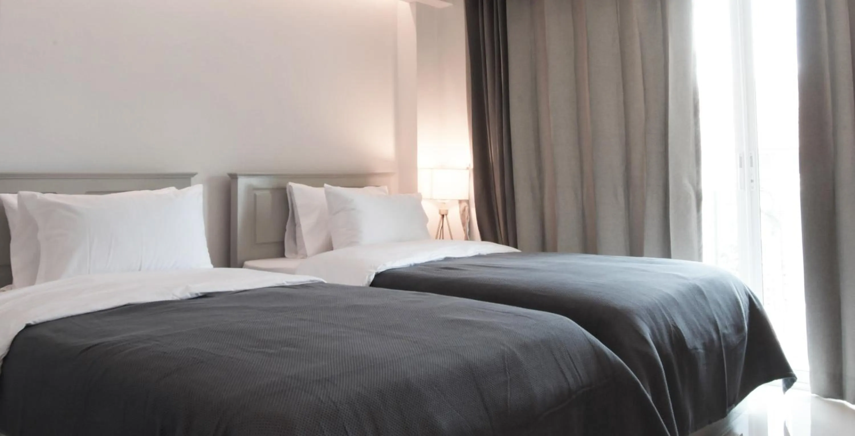 Bed in Tonkla Boutique Hotel