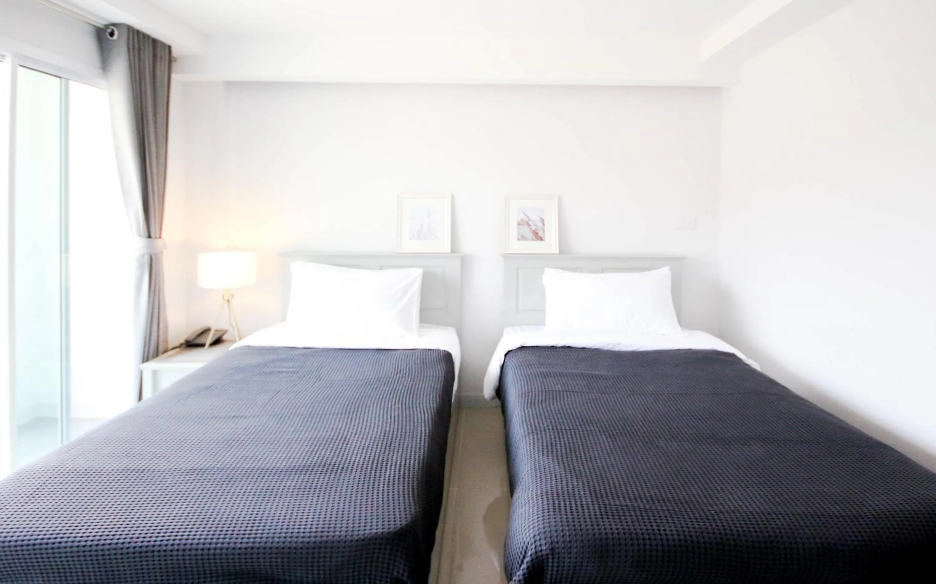 Bed in Tonkla Boutique Hotel