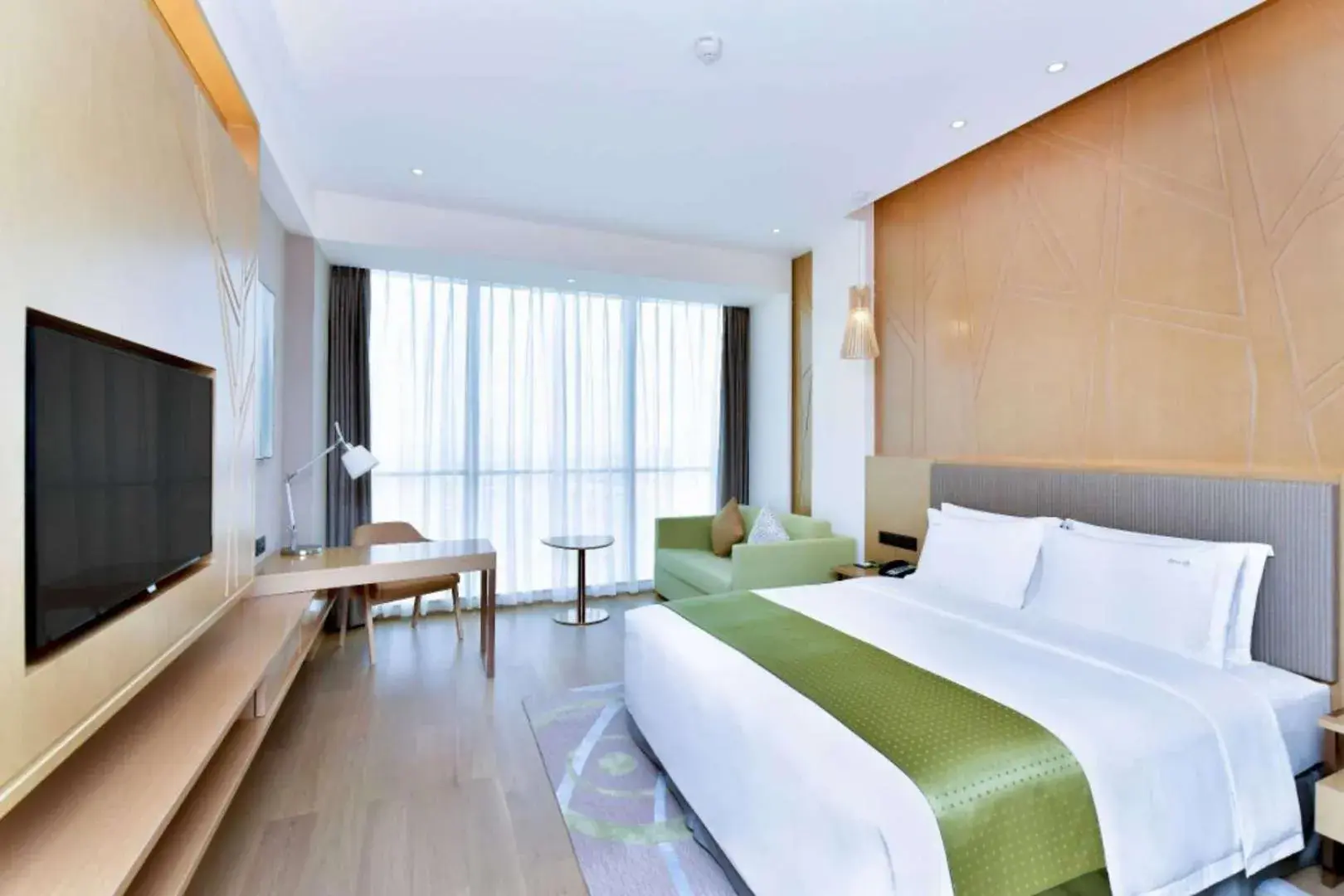 Bed in Holiday Inn Changsha Dawangshan by IHG Bed in Holiday Inn Changsha Dawangshan by IHG