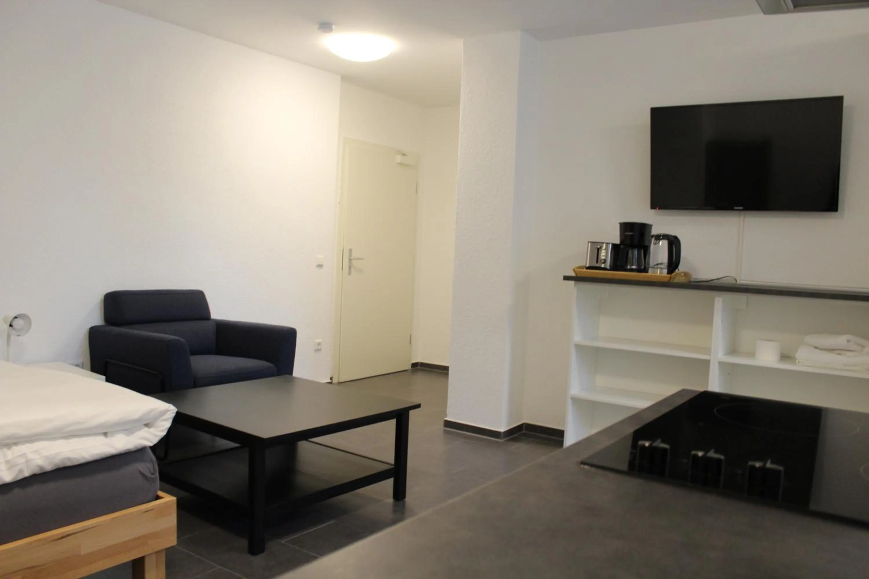 Seating area, Bed in Libarty Appartments