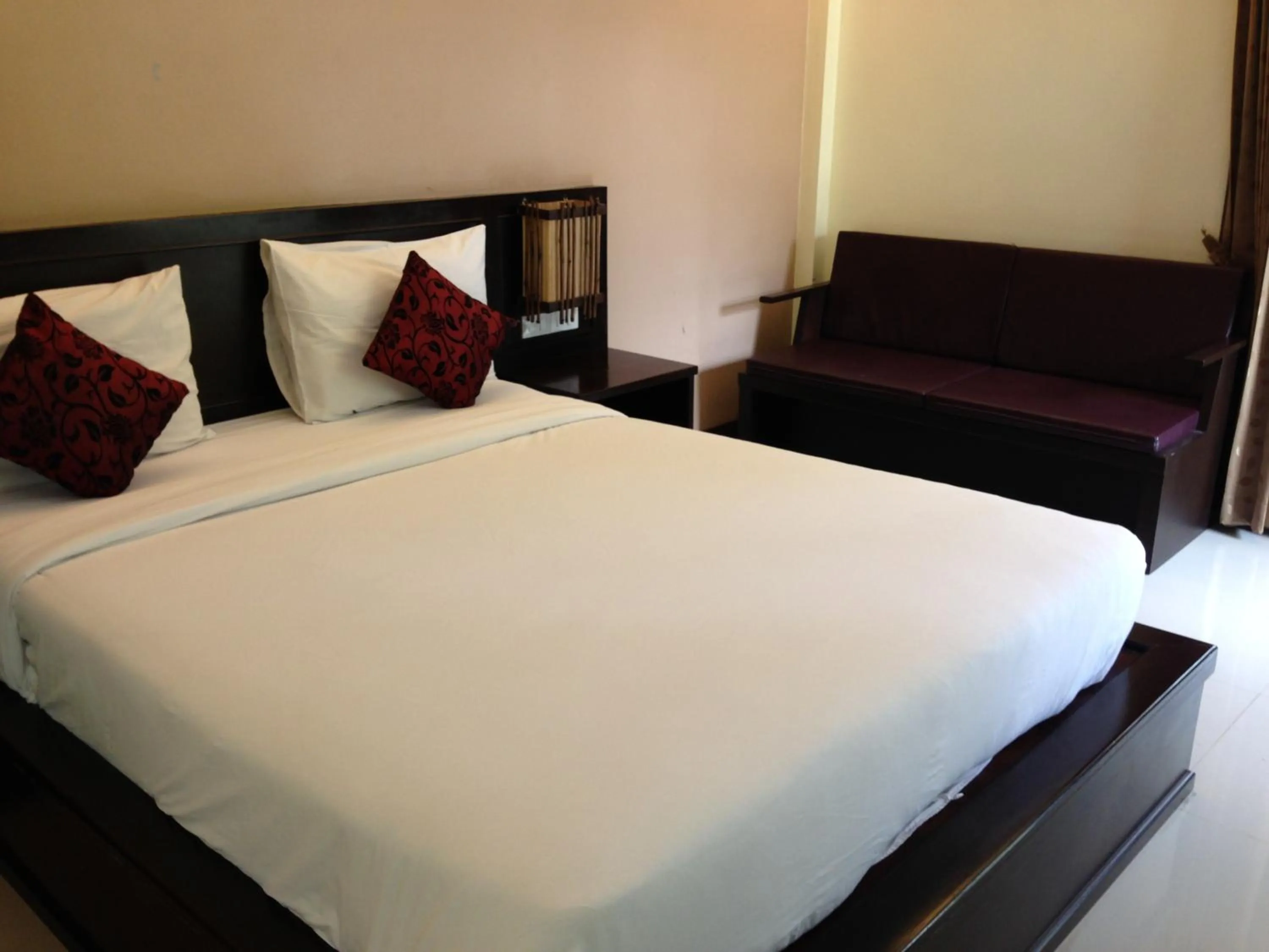 Bed in Palm Sweet Resort