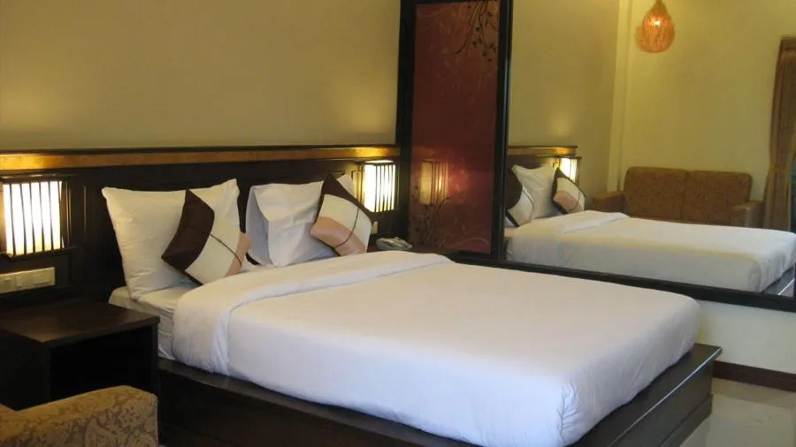 Bed in Palm Sweet Resort