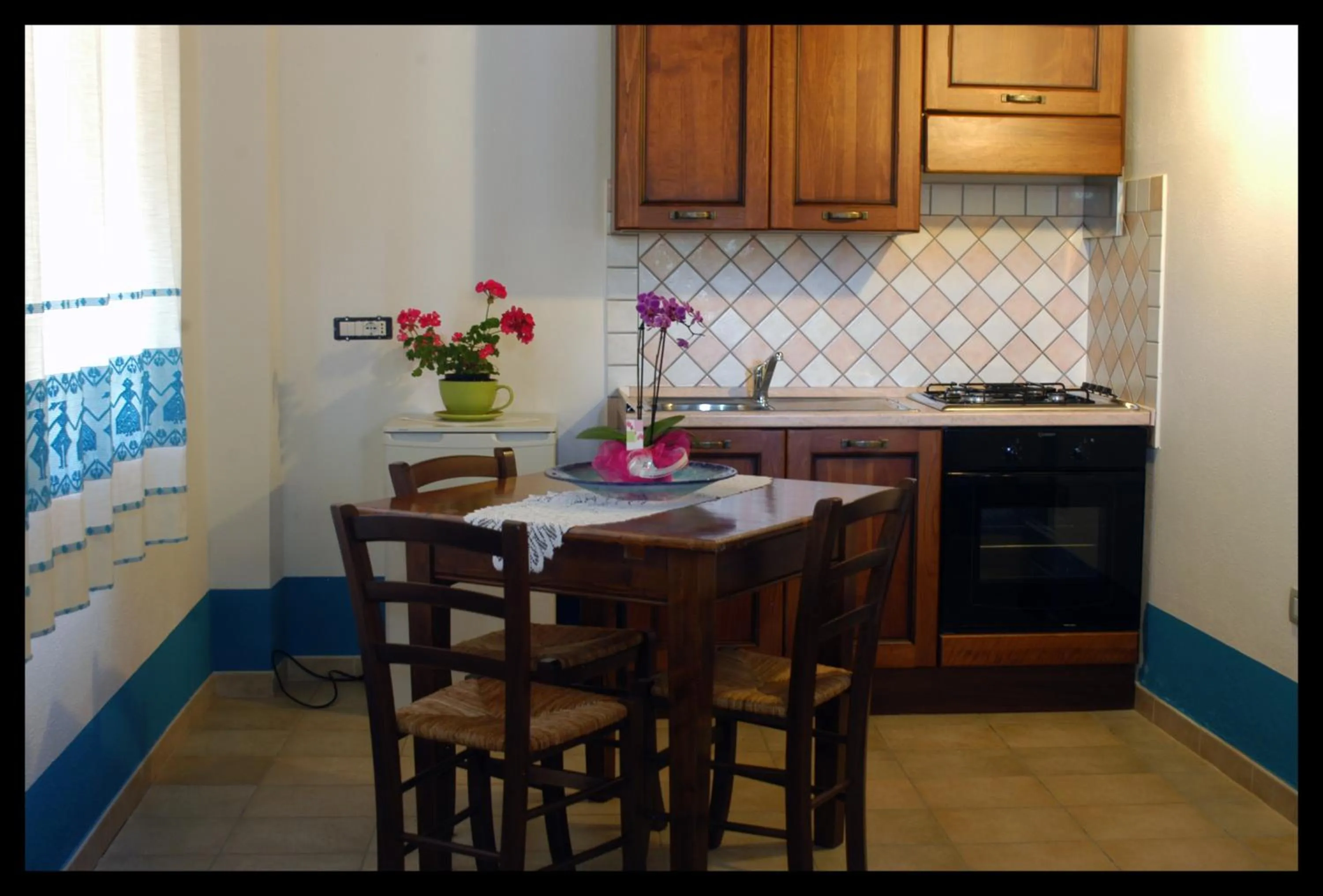 Kitchen or kitchenette in Country House S'Ozzastru