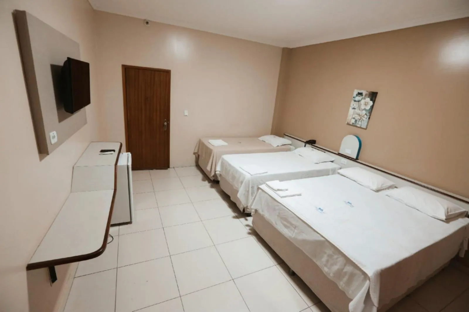 Bed in SERRA AZUL PLAZA HOTEL