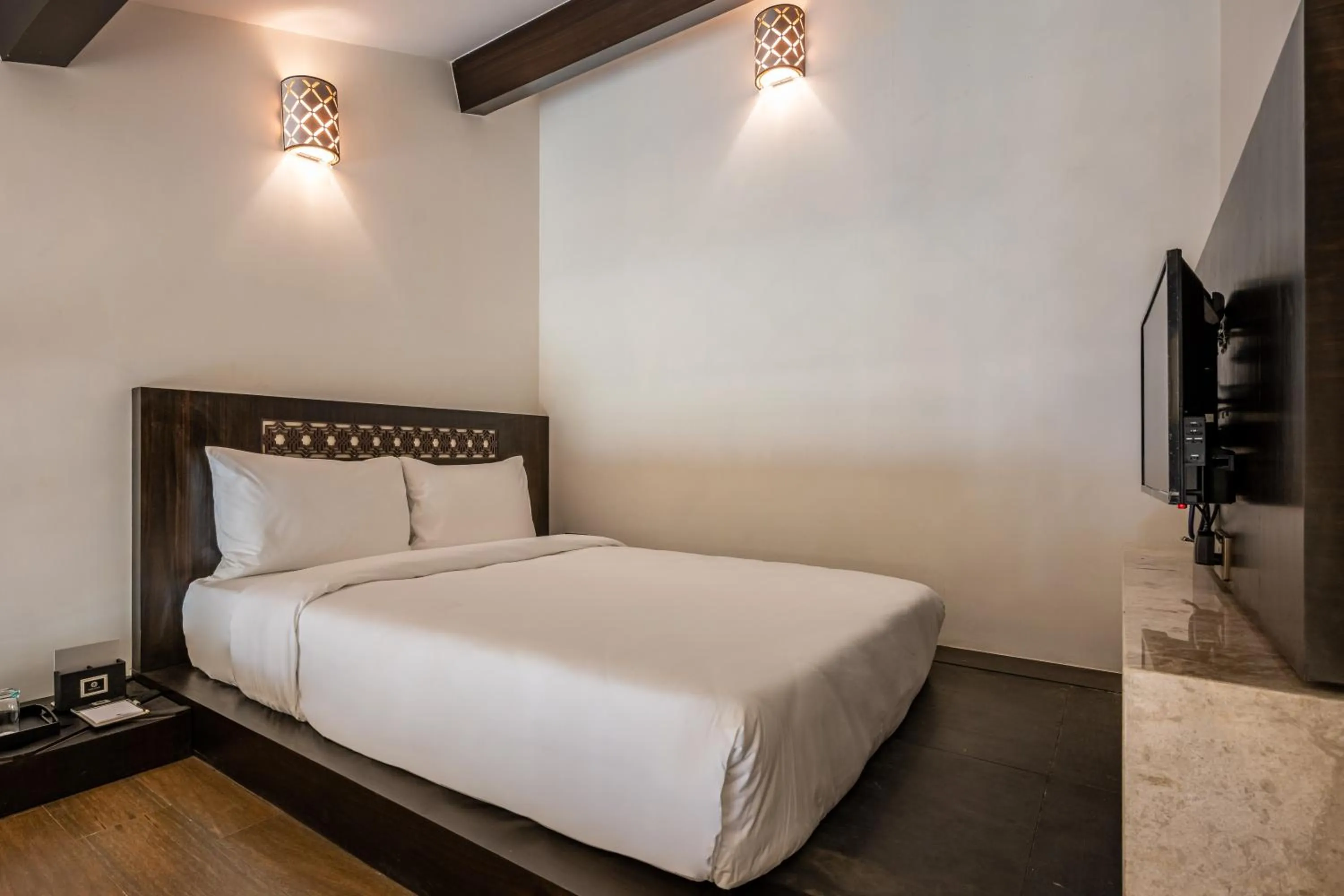 Bed in Silver Waves Resort & Spa - Daman