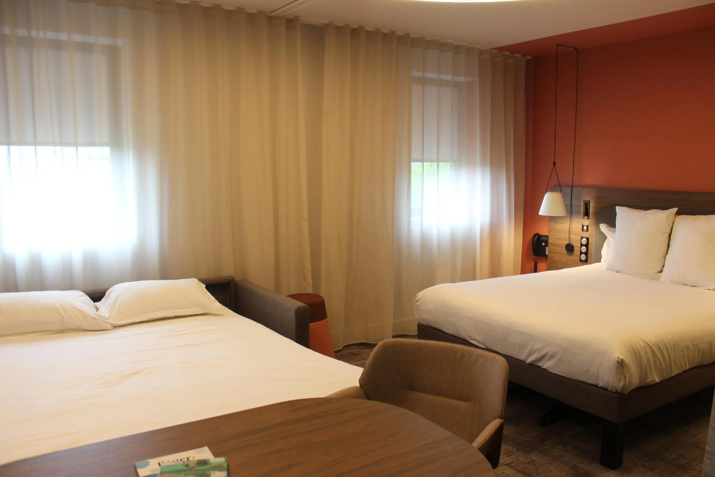 Bed in Novotel Suites Rouen Normandie