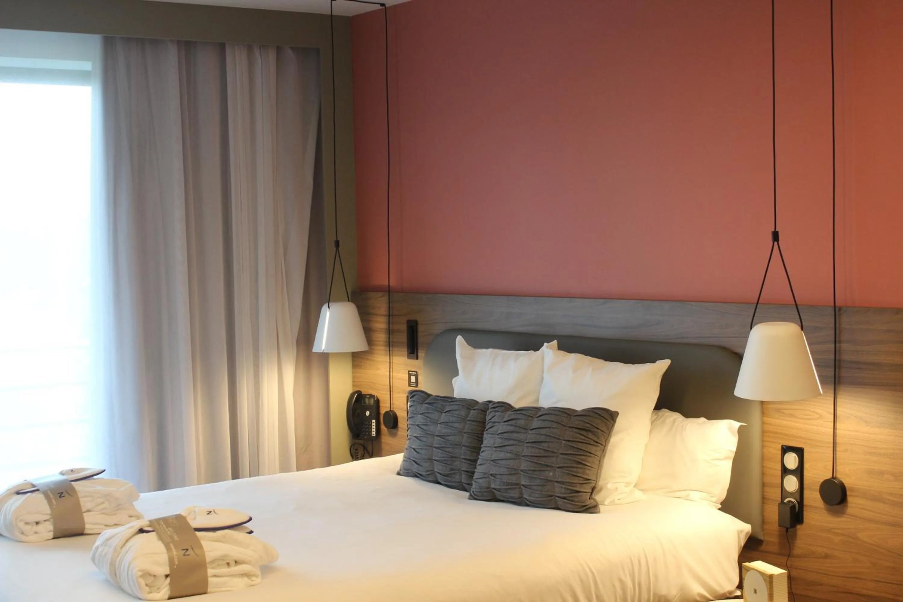 Bed in Novotel Suites Rouen Normandie