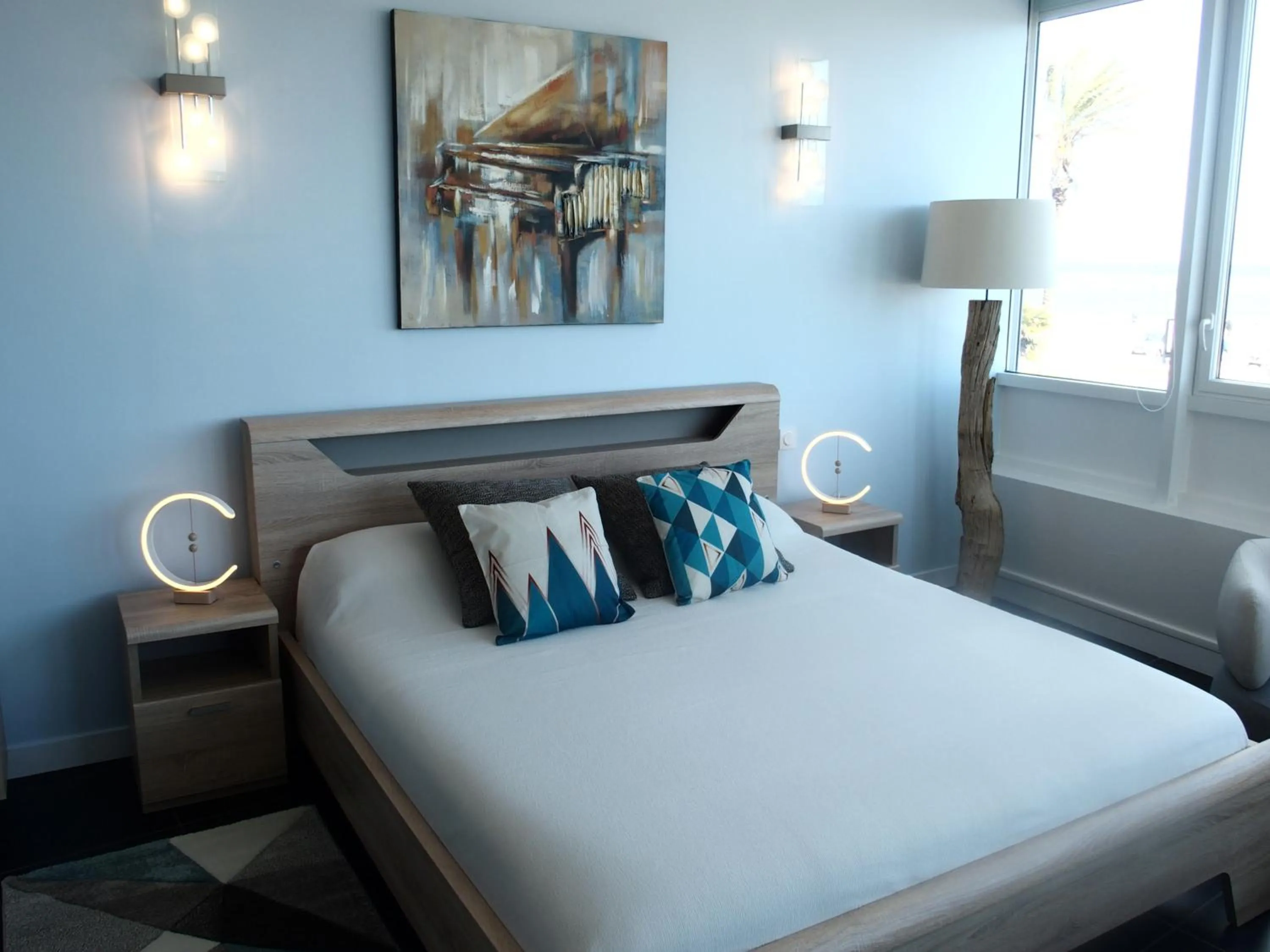 Bed in Bleu Mer Duplex & Suites