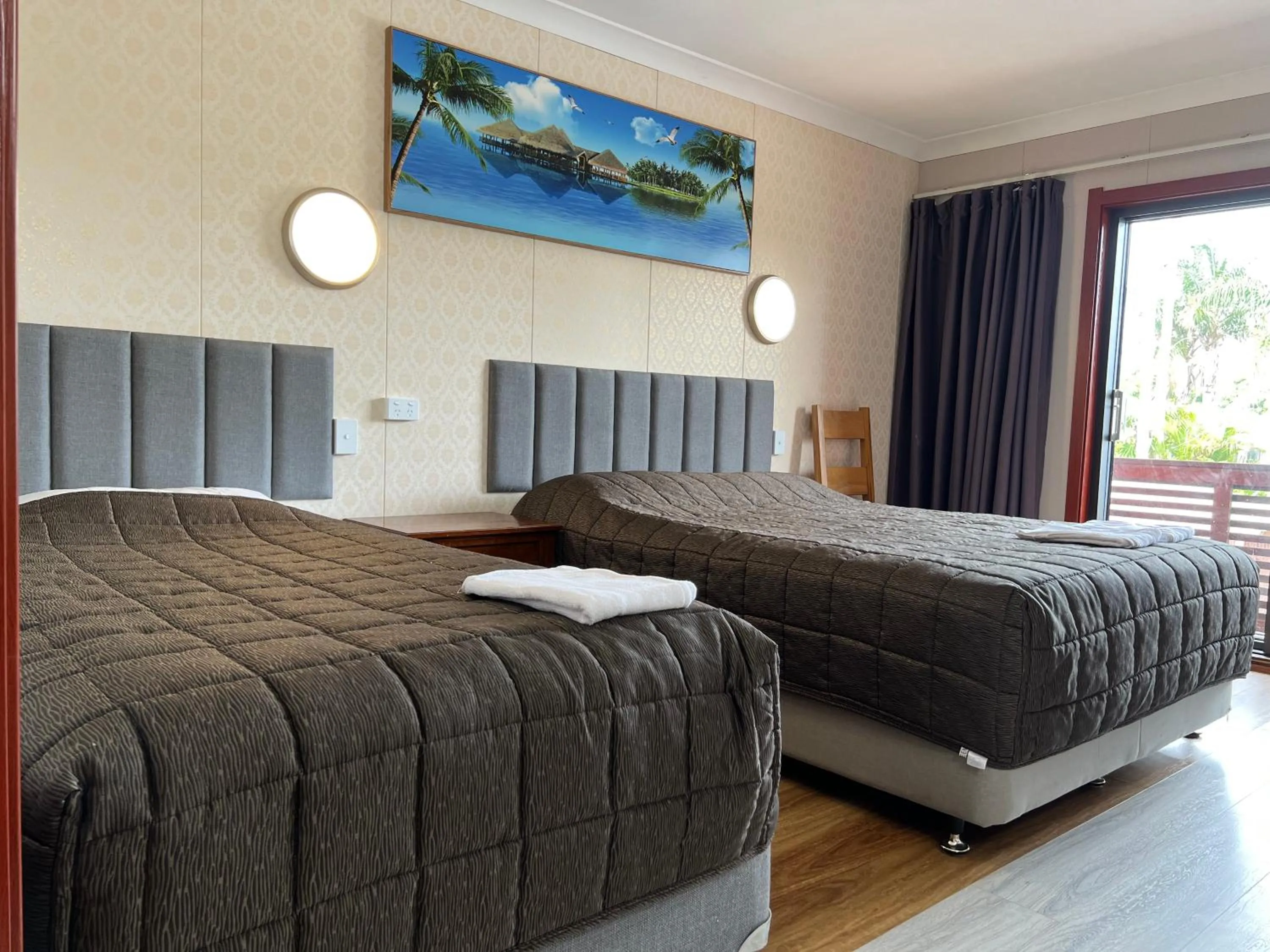 Bed in Central Jetty Motel