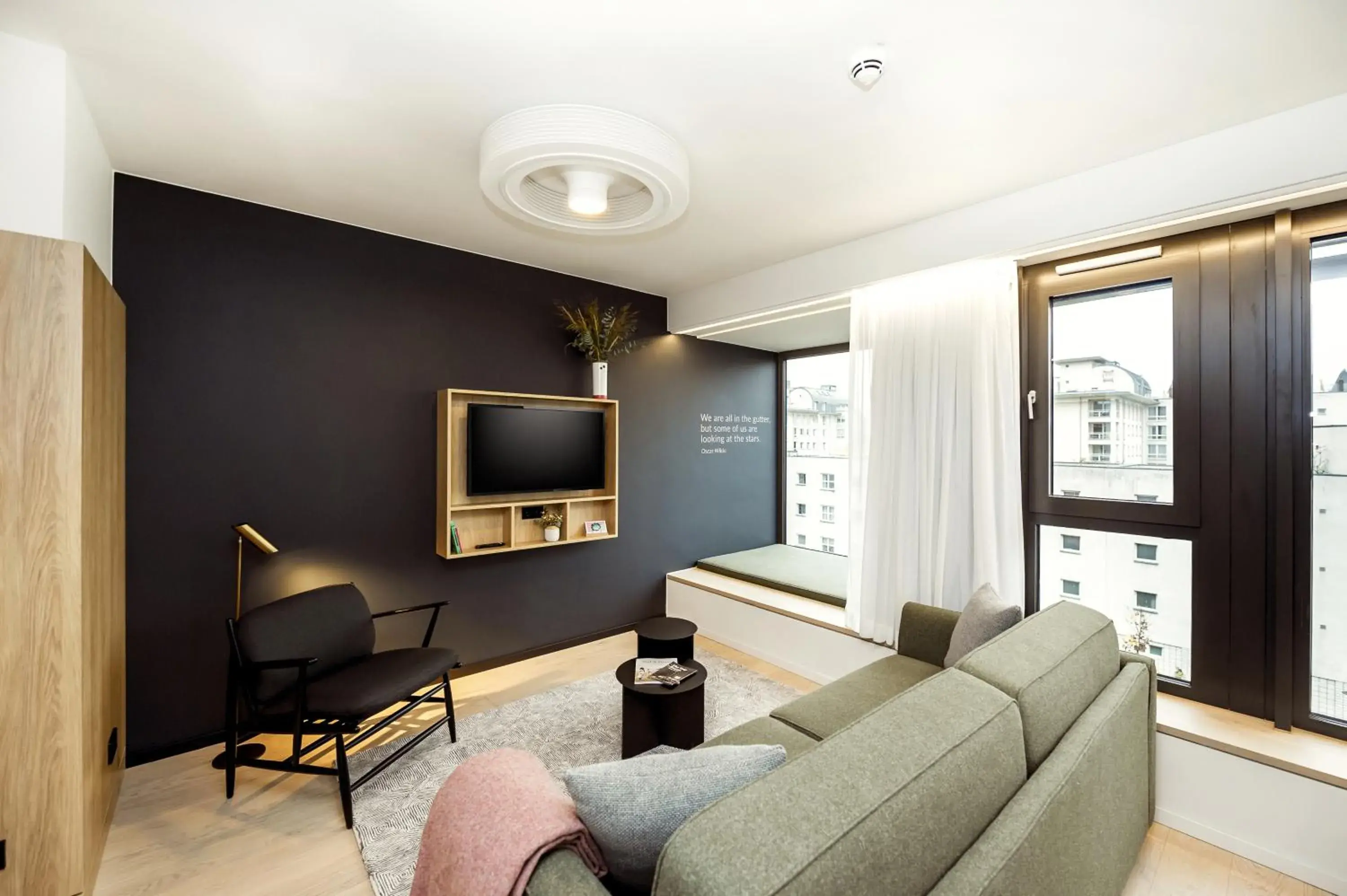 Living room in Wilde Aparthotels Berlin, Checkpoint Charlie Living room in Wilde Aparthotels Berlin, Checkpoint Charlie