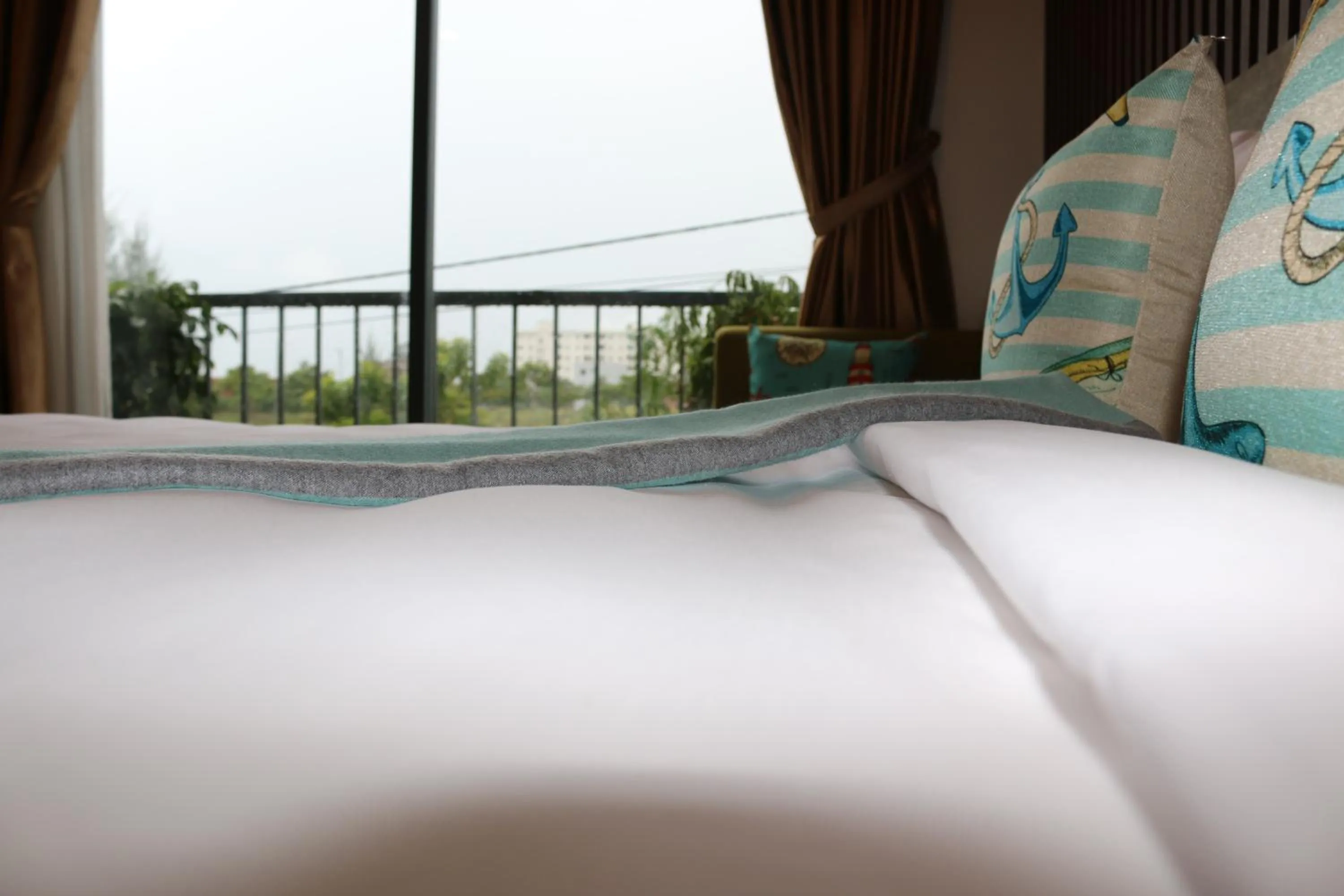 Bed in The Fish Village Villa