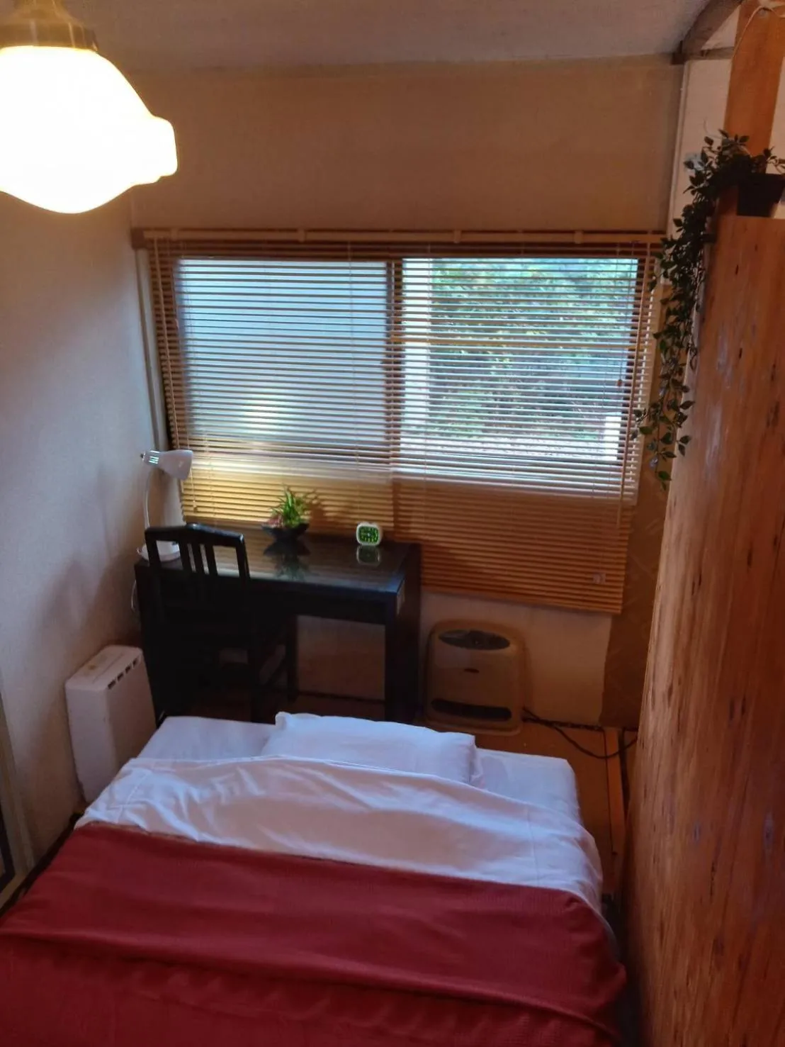 Bed in HAKUBA IKEDA LIFE KAN APARTMENTS