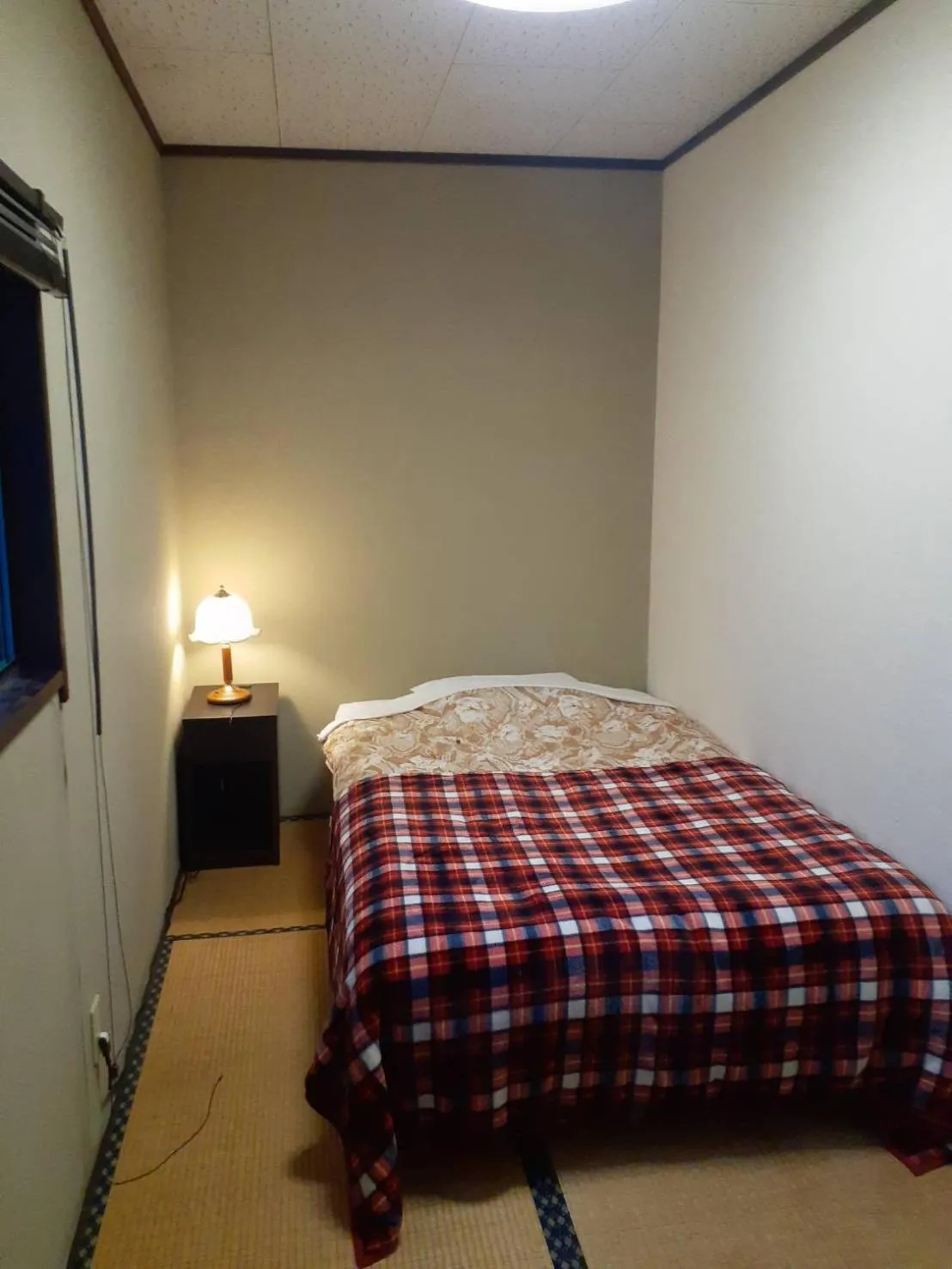 Bed in HAKUBA IKEDA LIFE KAN APARTMENTS