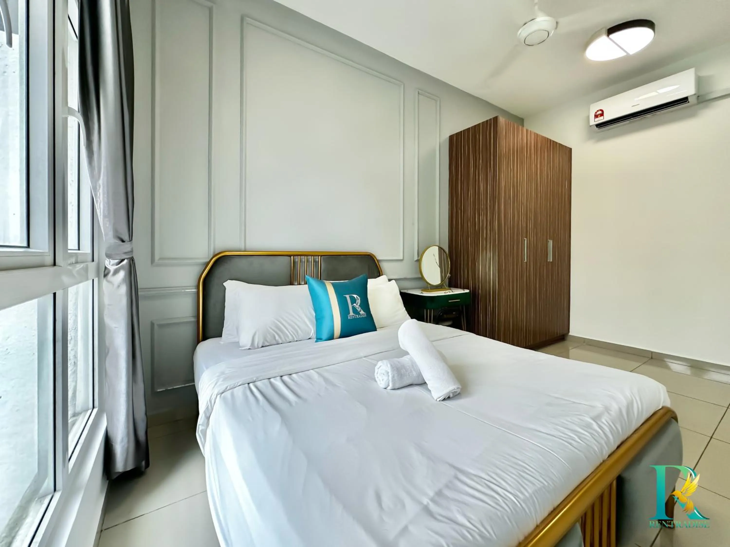 Bed in Seasons Luxury Apartment By RR JBcity
