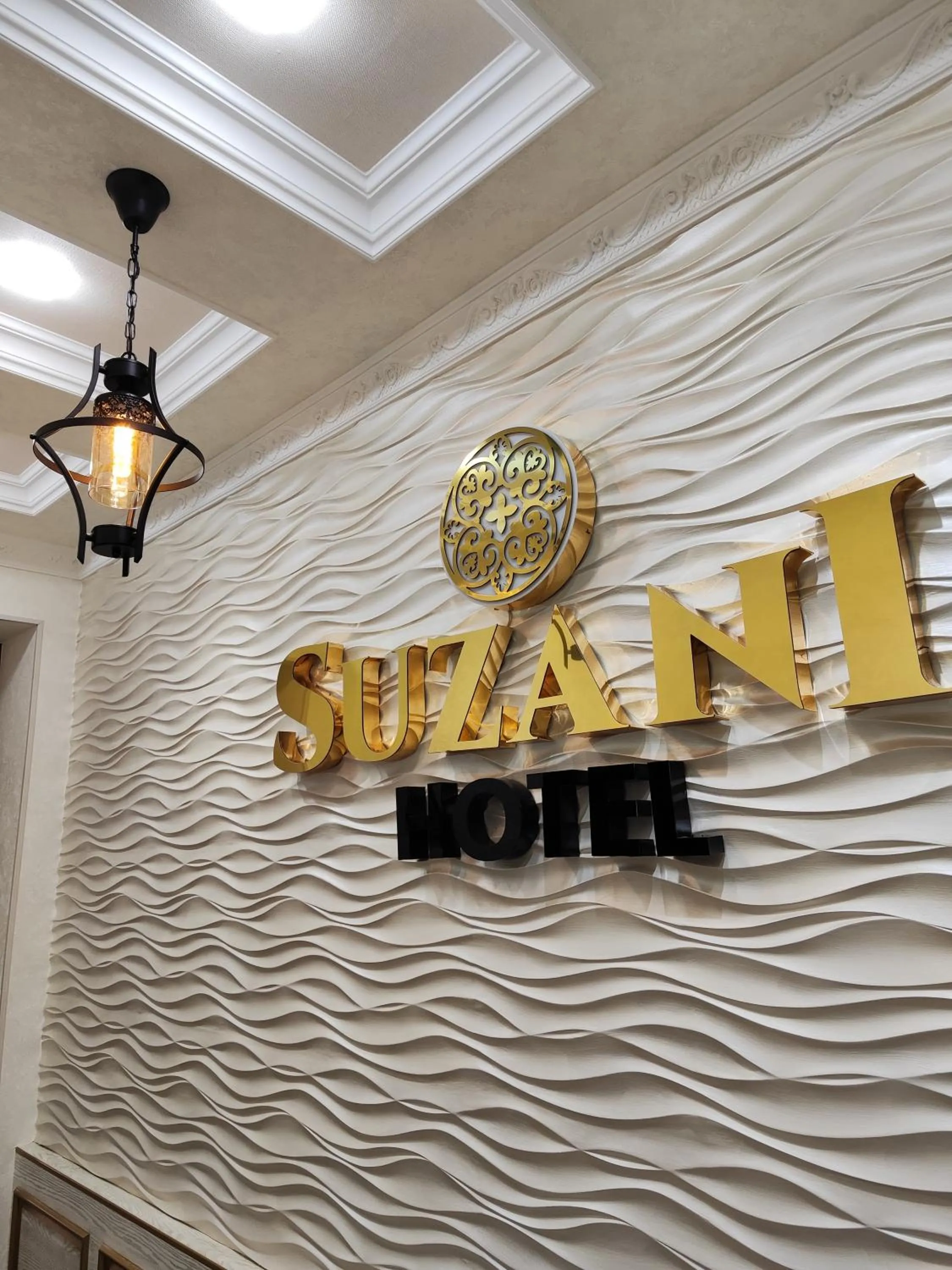 Property logo or sign in Hotel Suzani Samarkand