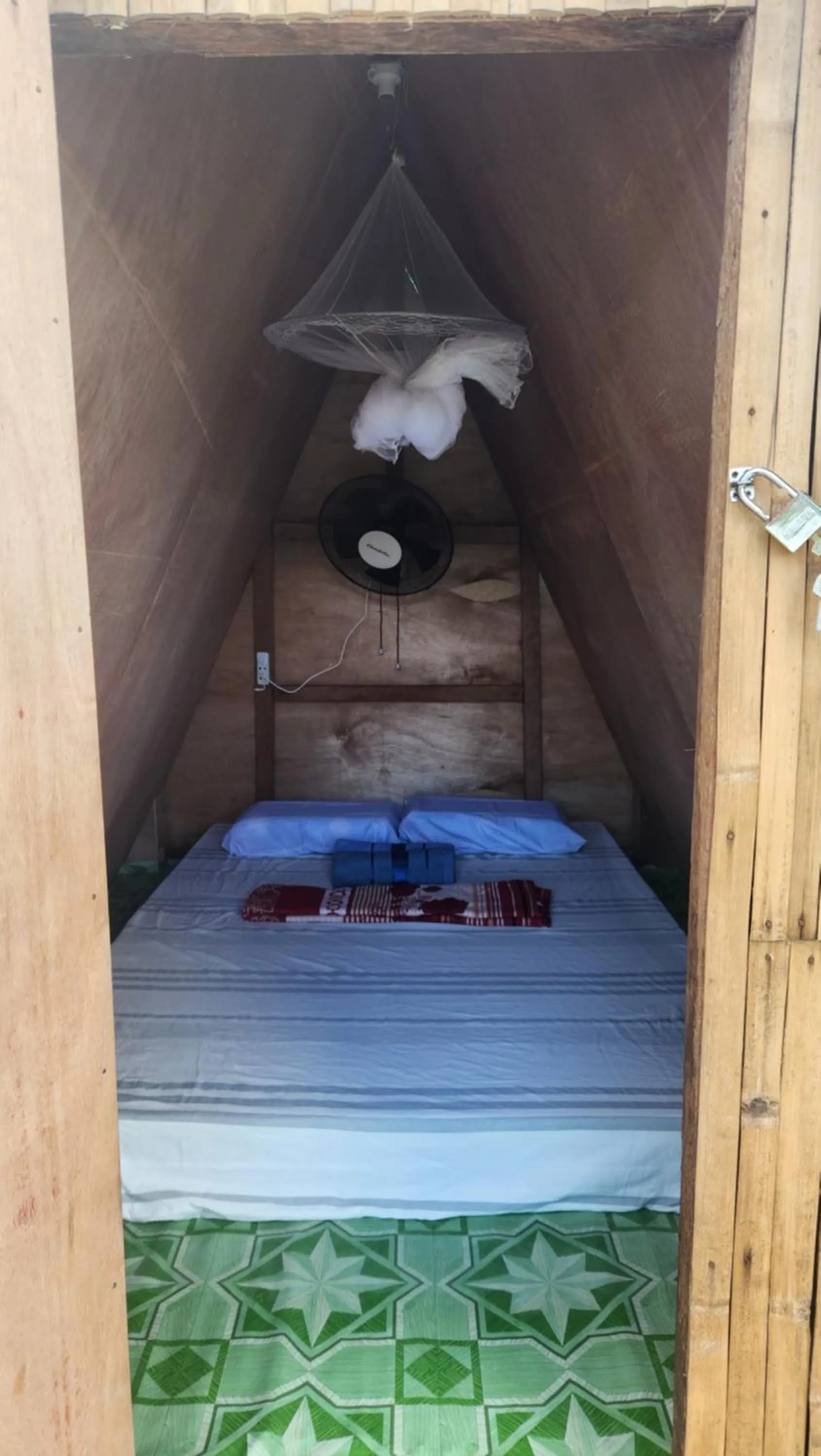 Bed in Nirvana Bamboo & Dive resort