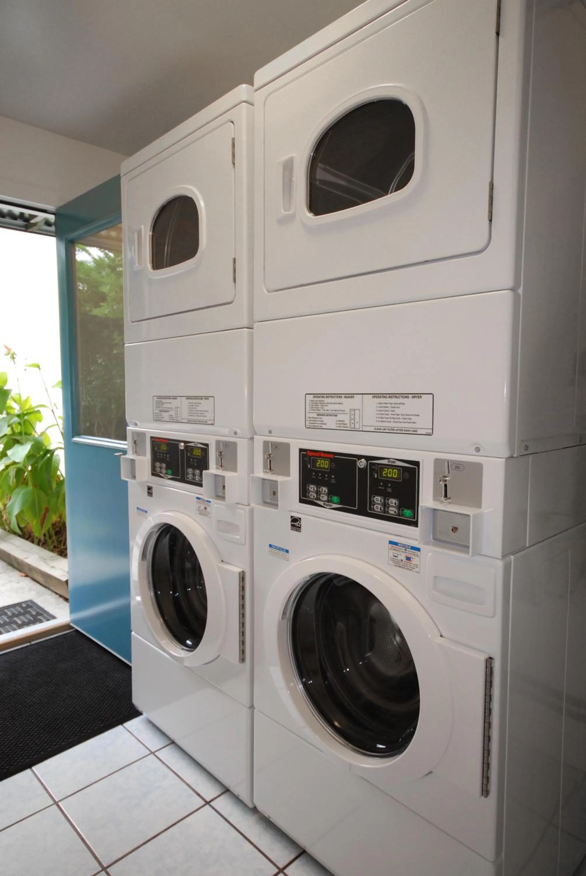 washing machine in Studios On 25th by BCA Furnished Apartments