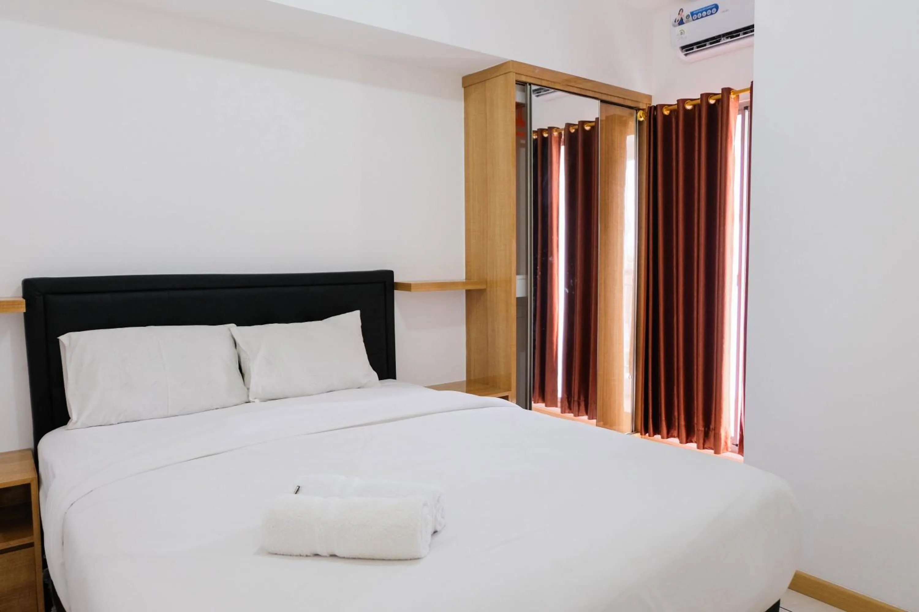 Bedroom, Bed in Comfortable 2BR Apartment at M-Town Residence By Travelio