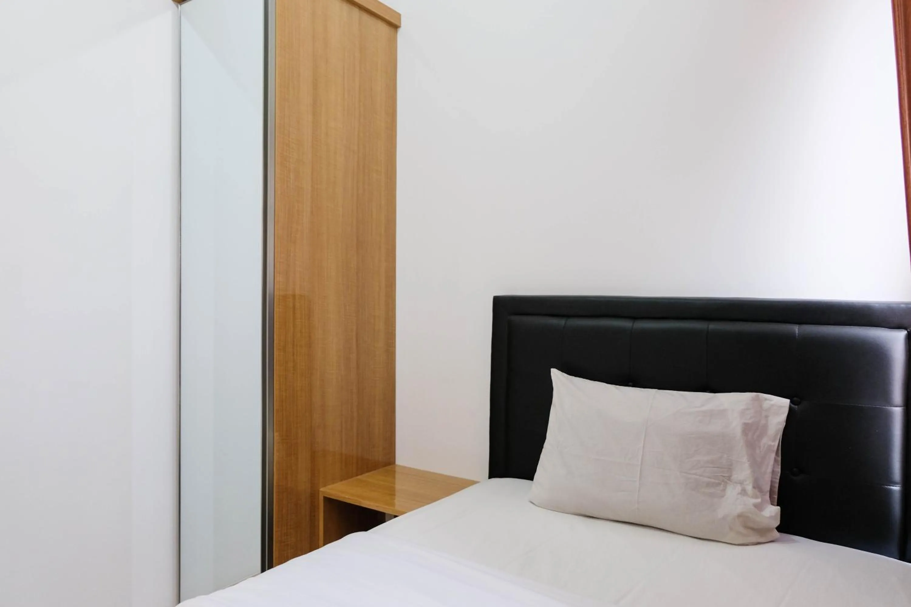 Bed in Comfortable 2BR Apartment at M-Town Residence By Travelio