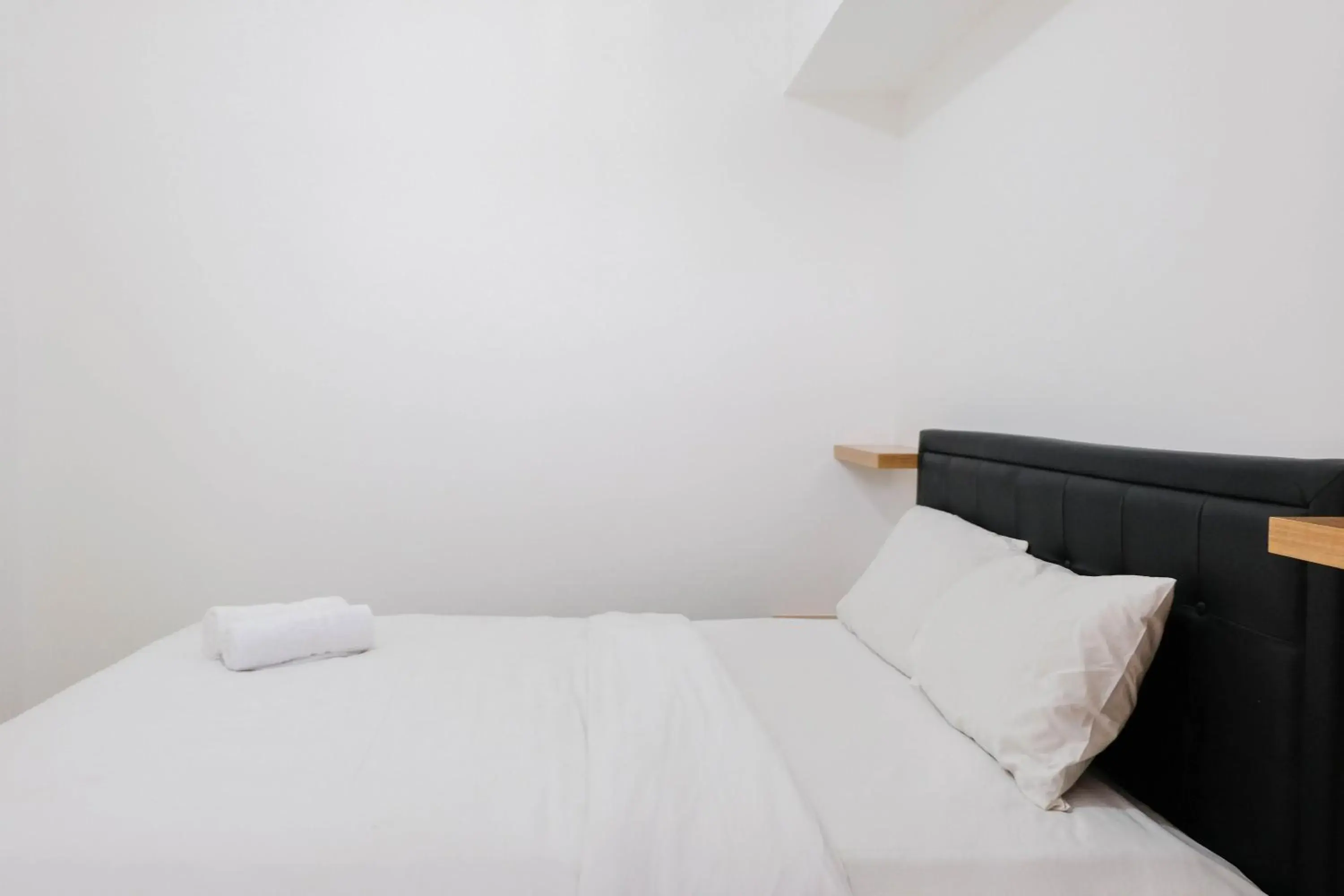 Bed in Comfortable 2BR Apartment at M-Town Residence By Travelio Bed in Comfortable 2BR Apartment at M-Town Residence By Travelio