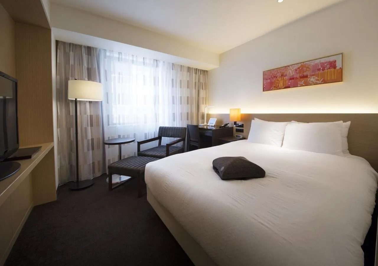 Bed in HOTEL FORZA HAKATAEKI CHIKUSHI-GUCHI Ⅰ