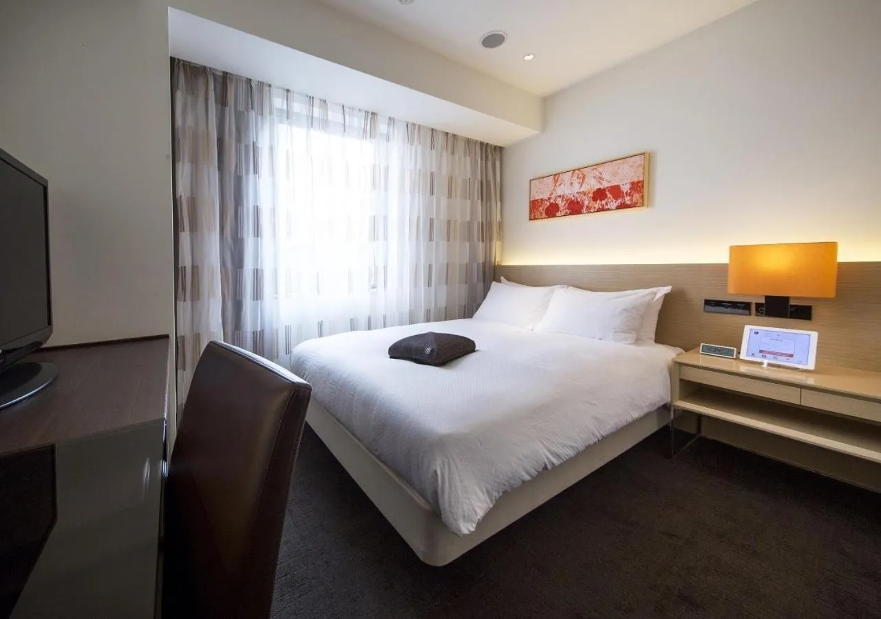 Bed in HOTEL FORZA HAKATAEKI CHIKUSHI-GUCHI Ⅰ