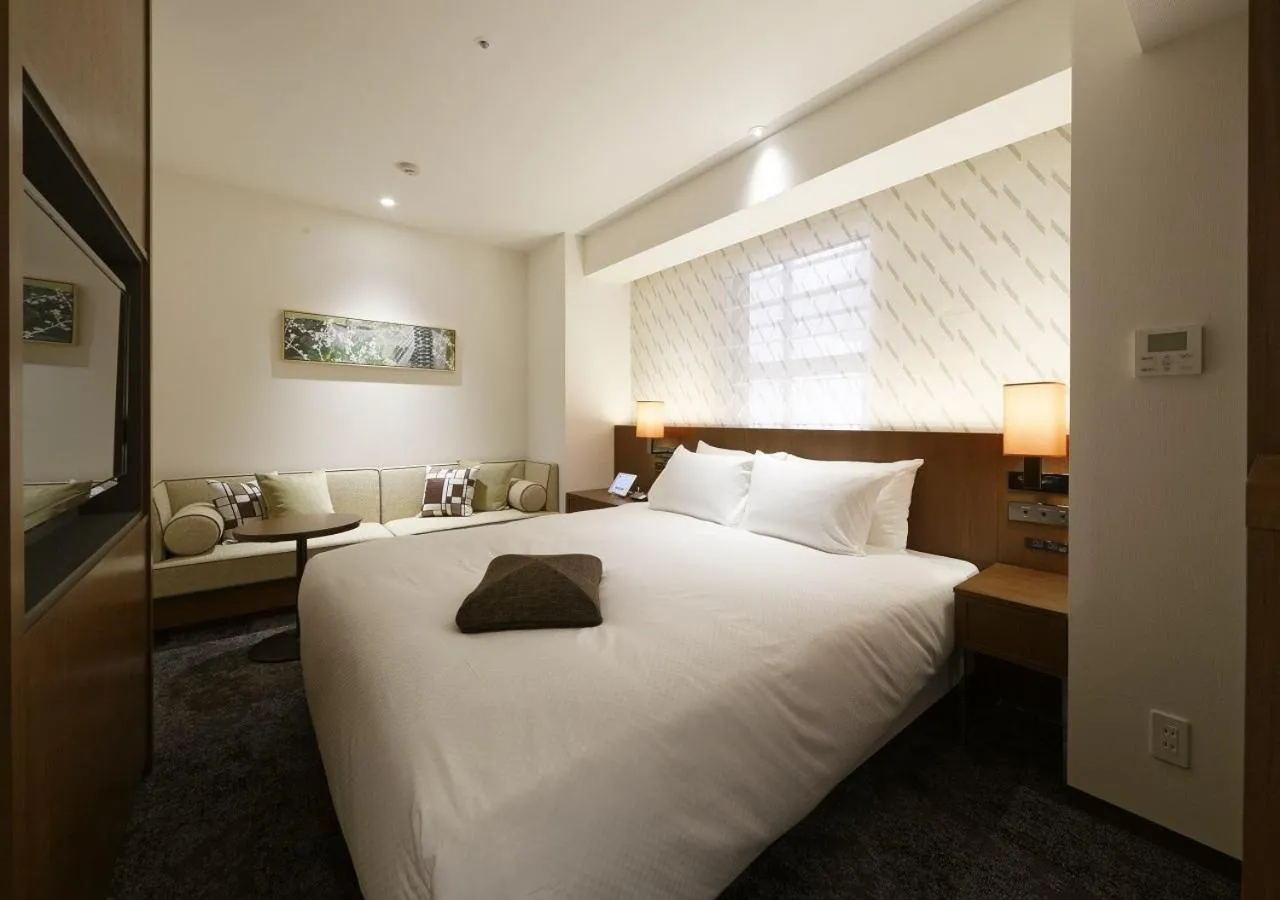 Bed in HOTEL FORZA HAKATAEKI CHIKUSHI-GUCHI Ⅰ