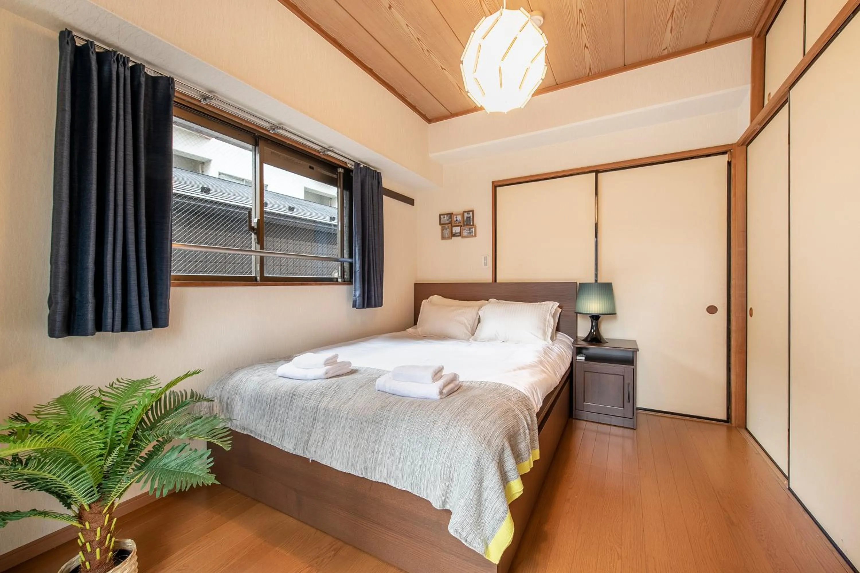Bed in Uhome Akihabara Apartment 3