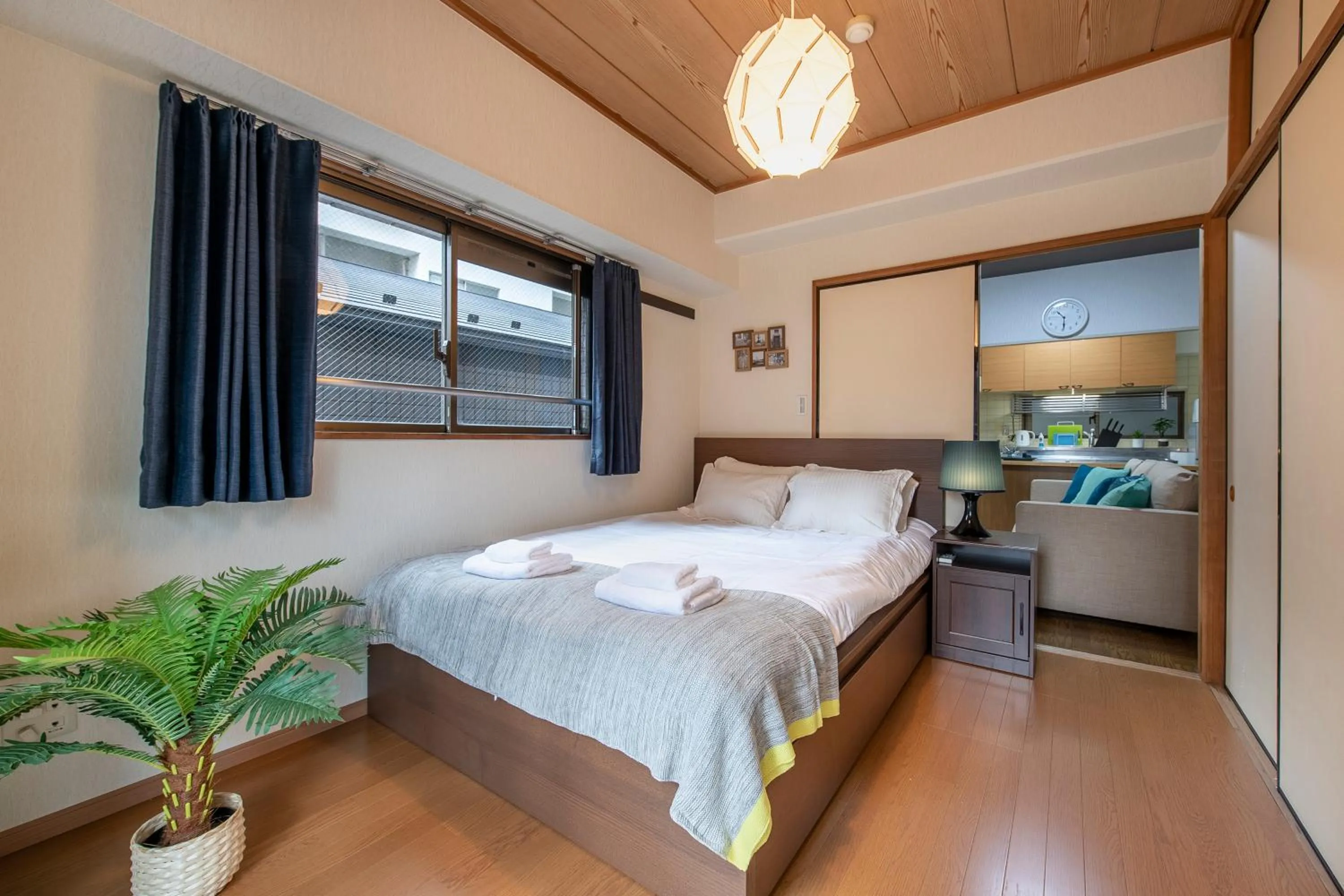 Bed in Uhome Akihabara Apartment 3