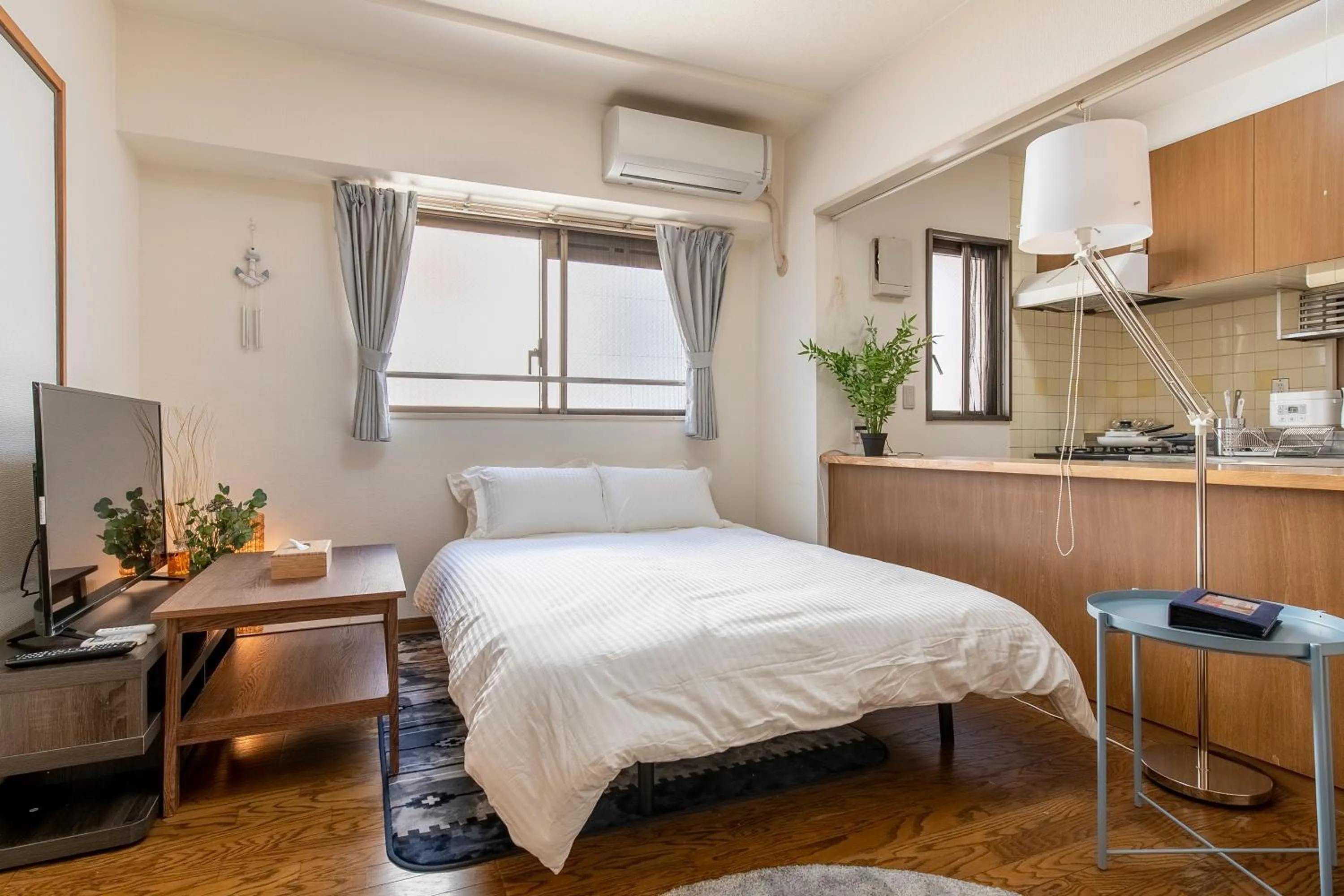 Bed in Uhome Akihabara Apartment 3