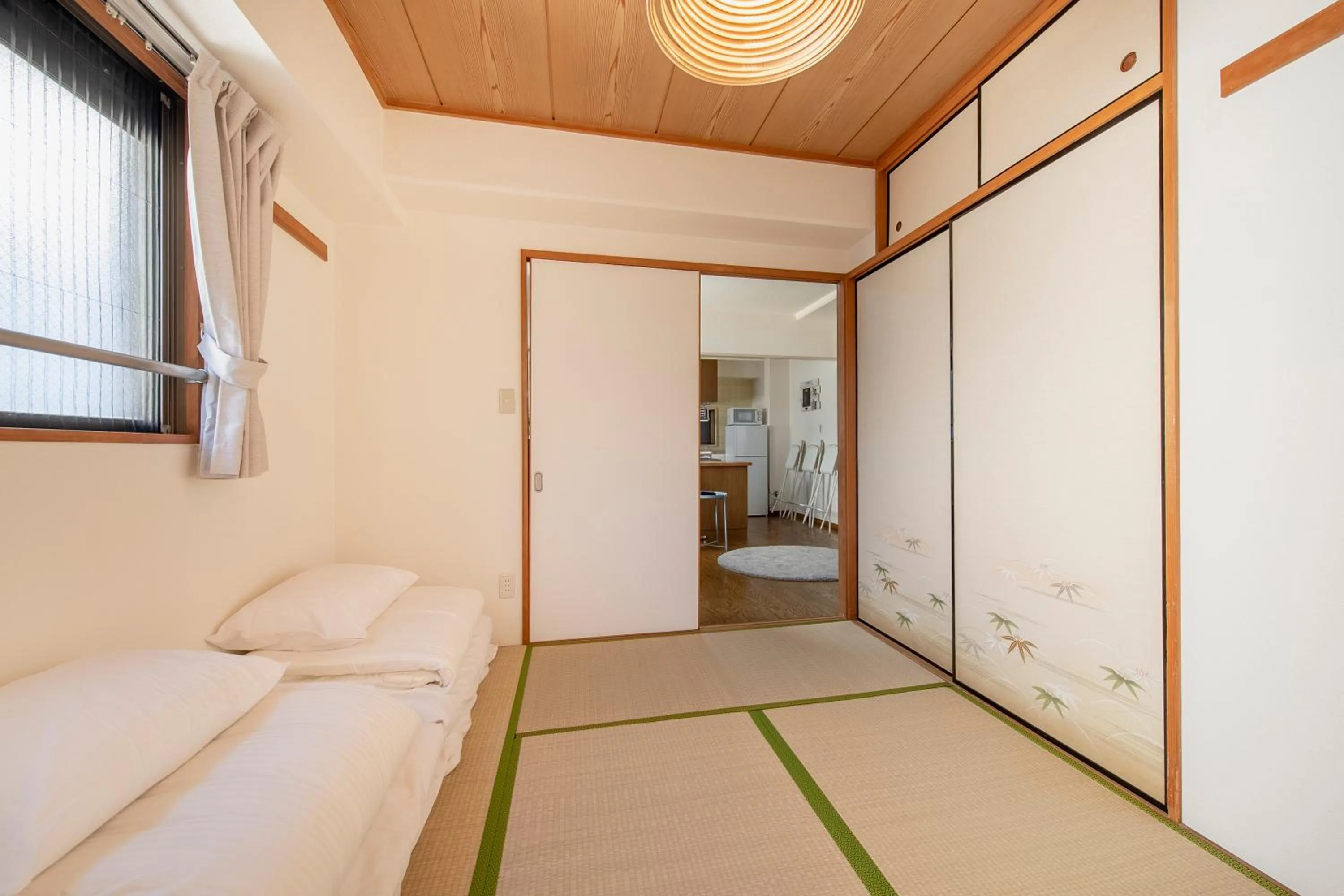 Bed in Uhome Akihabara Apartment 3