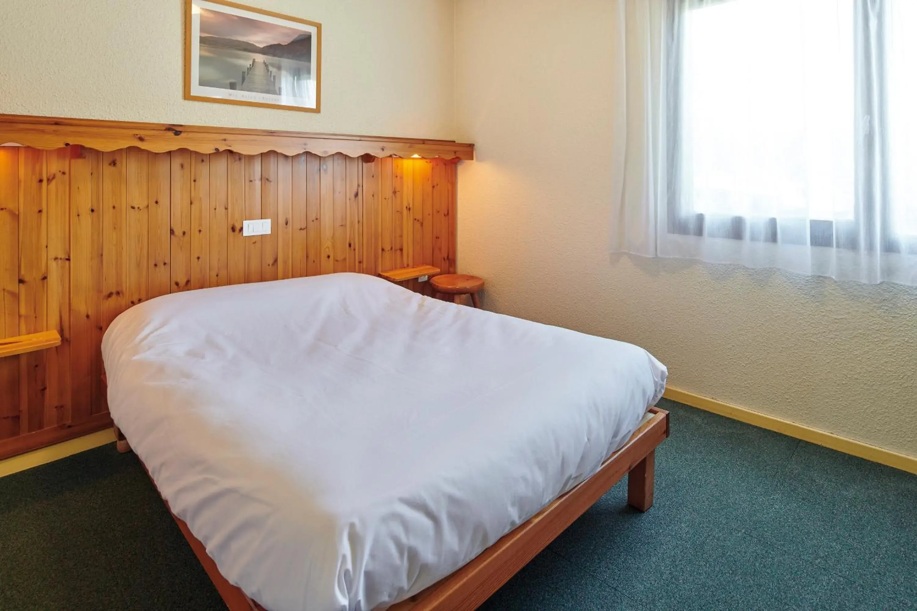 Bed in Club Vacances Bleues Les Horizons du Lac (anciennement Serre-du-Villard) Bed in Club Vacances Bleues Les Horizons du Lac (anciennement Serre-du-Villard)