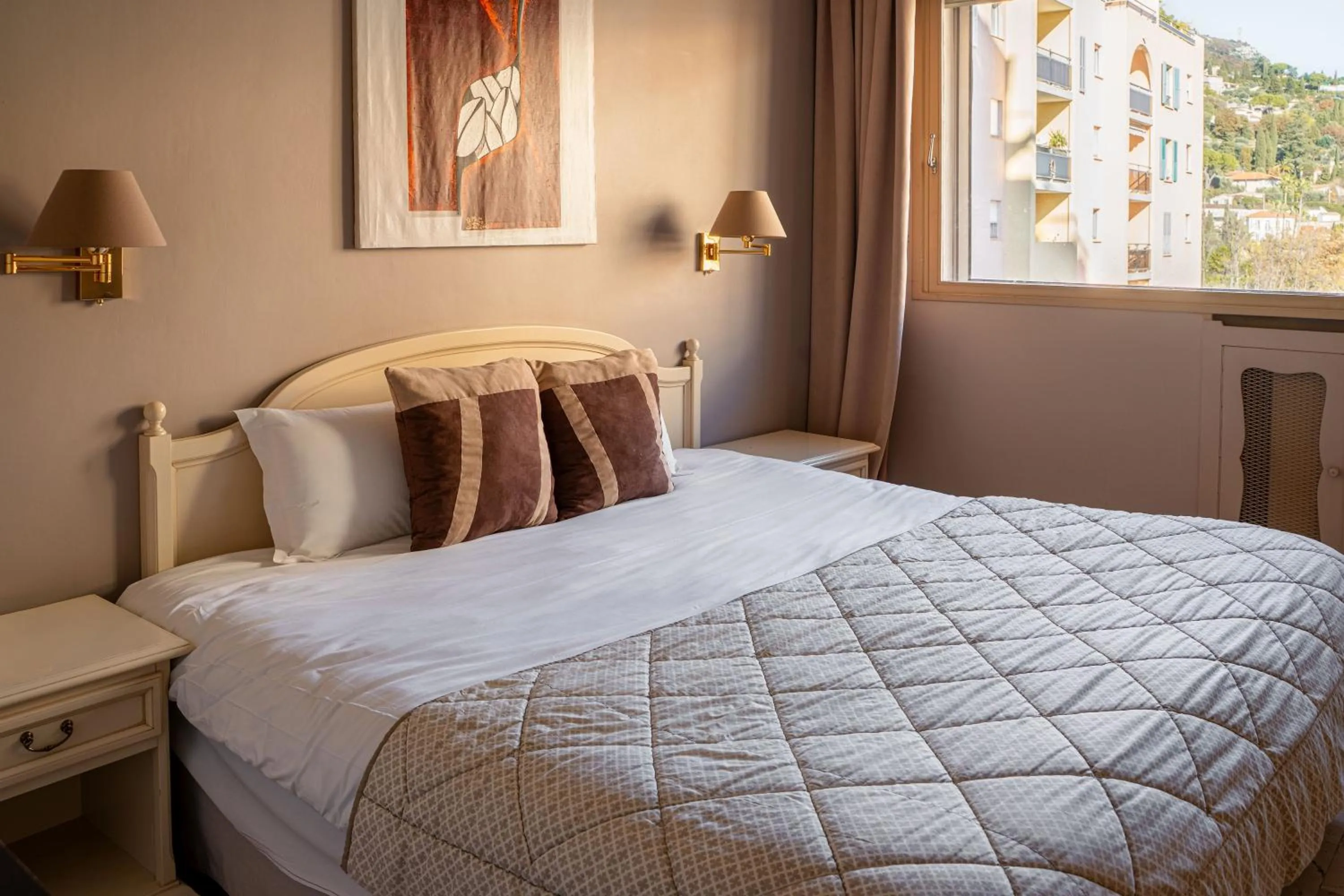 Bed in Logis Hotel Diana