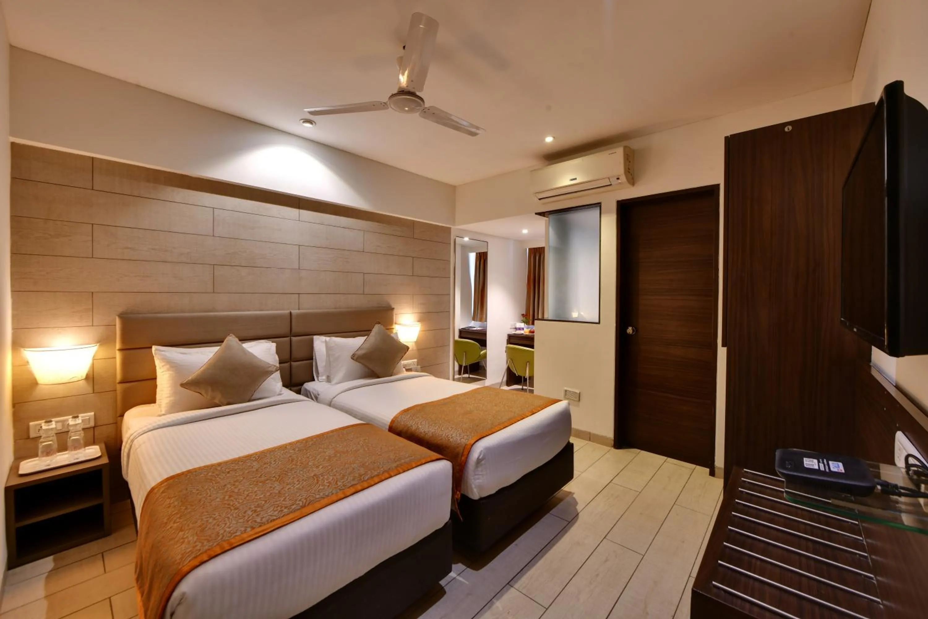 Photo of the whole room, Bed in Click Hotel Vadodara 4 mins walk for the Railway Station