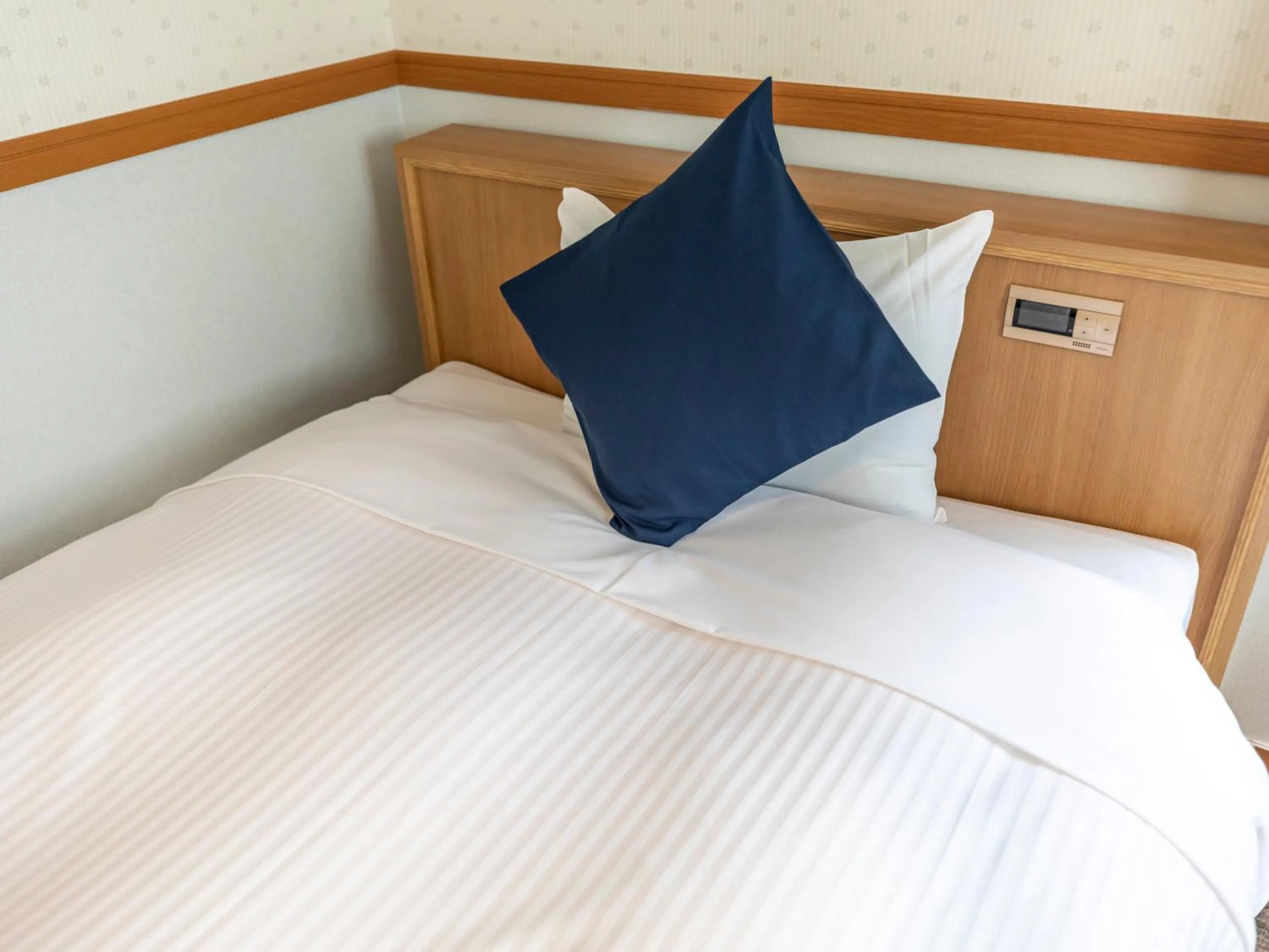 Bed in Tabist Asa Station Hotel