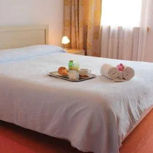 Bed in Albergo Croce d'Aune