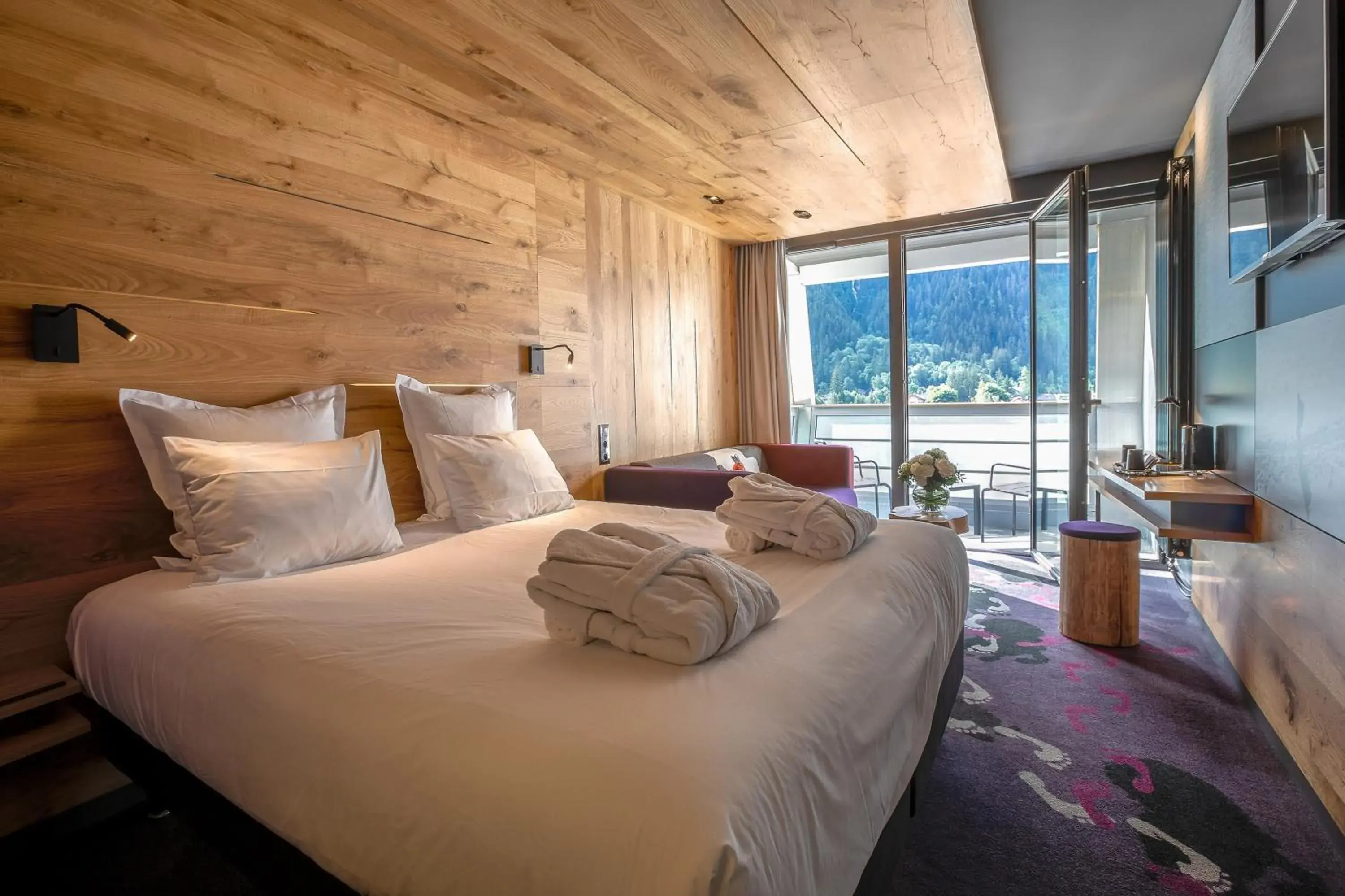 Superior Room with sofa and balcony – Mont-Blanc Range view in Alpina Eclectic Hotel Superior Room with sofa and balcony – Mont-Blanc Range view in Alpina Eclectic Hotel
